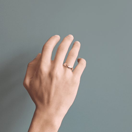 Model wearing Horus Band / Marquise Diamond on ring finger