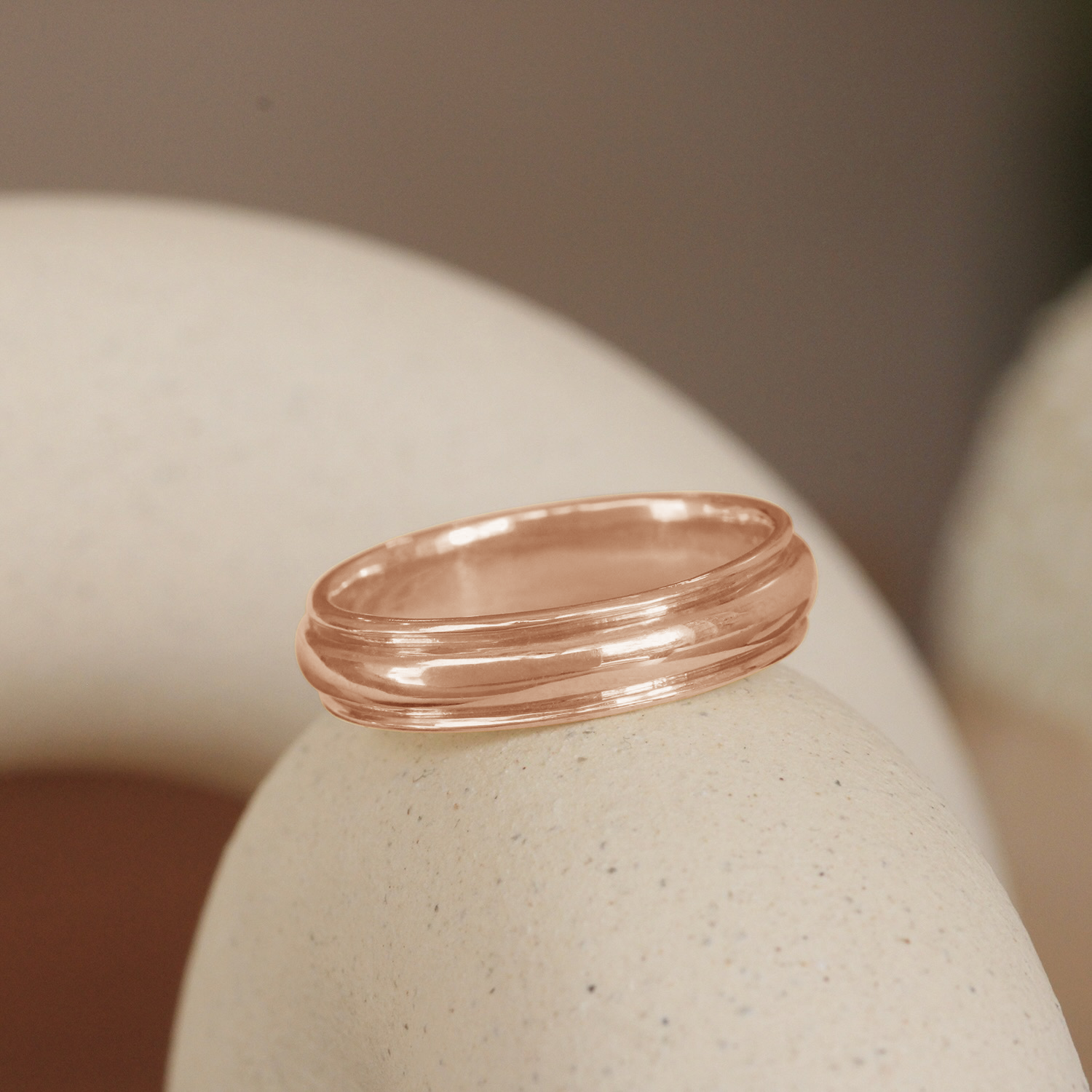 Lifestyle angled view of Cornice Band Wide in 14k Rose Gold