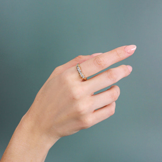 Model wearing Cloud Band / Champagne Grey Round Diamonds on index finger