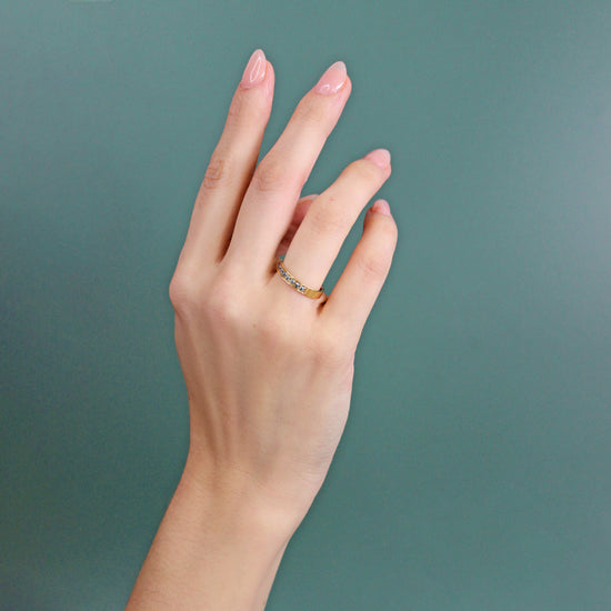 Model wears Flat Band / Bright Cut Salt & Pepper Diamonds on ring finger