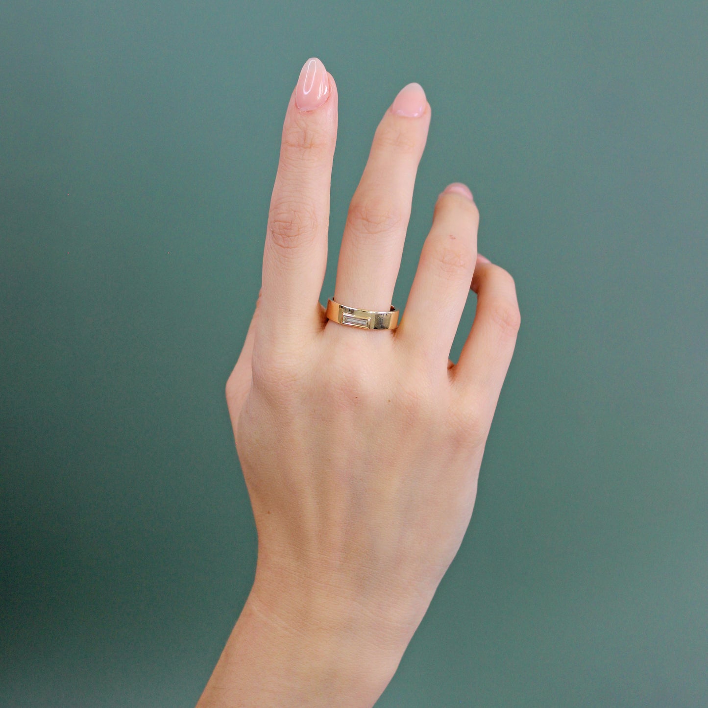 Model wearing Horizon Band / Skinny Baguette Diamond on middle finger