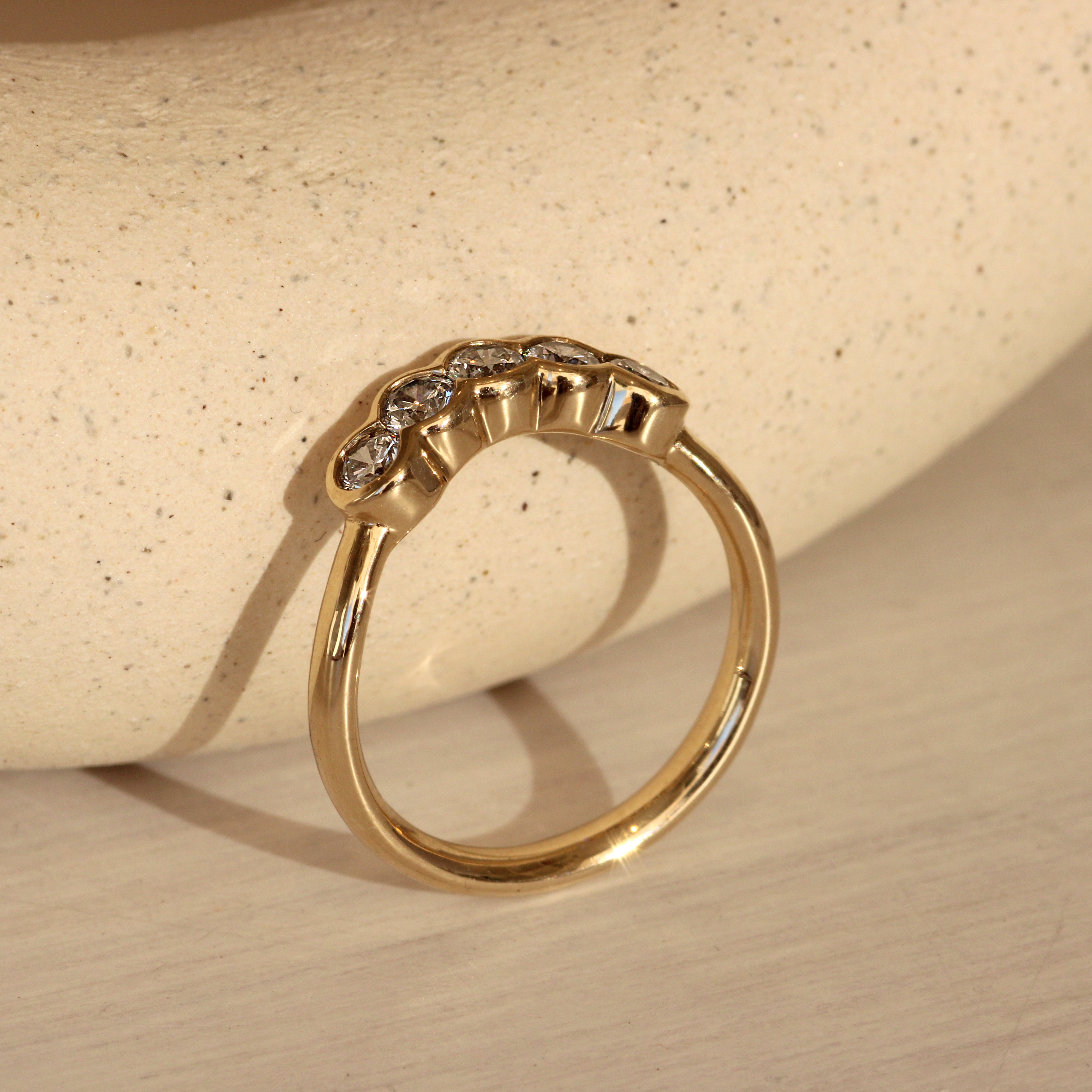 Lifestyle side profile view of Cloud 5 Band Curve Round Lab Diamonds in 14k yellow gold