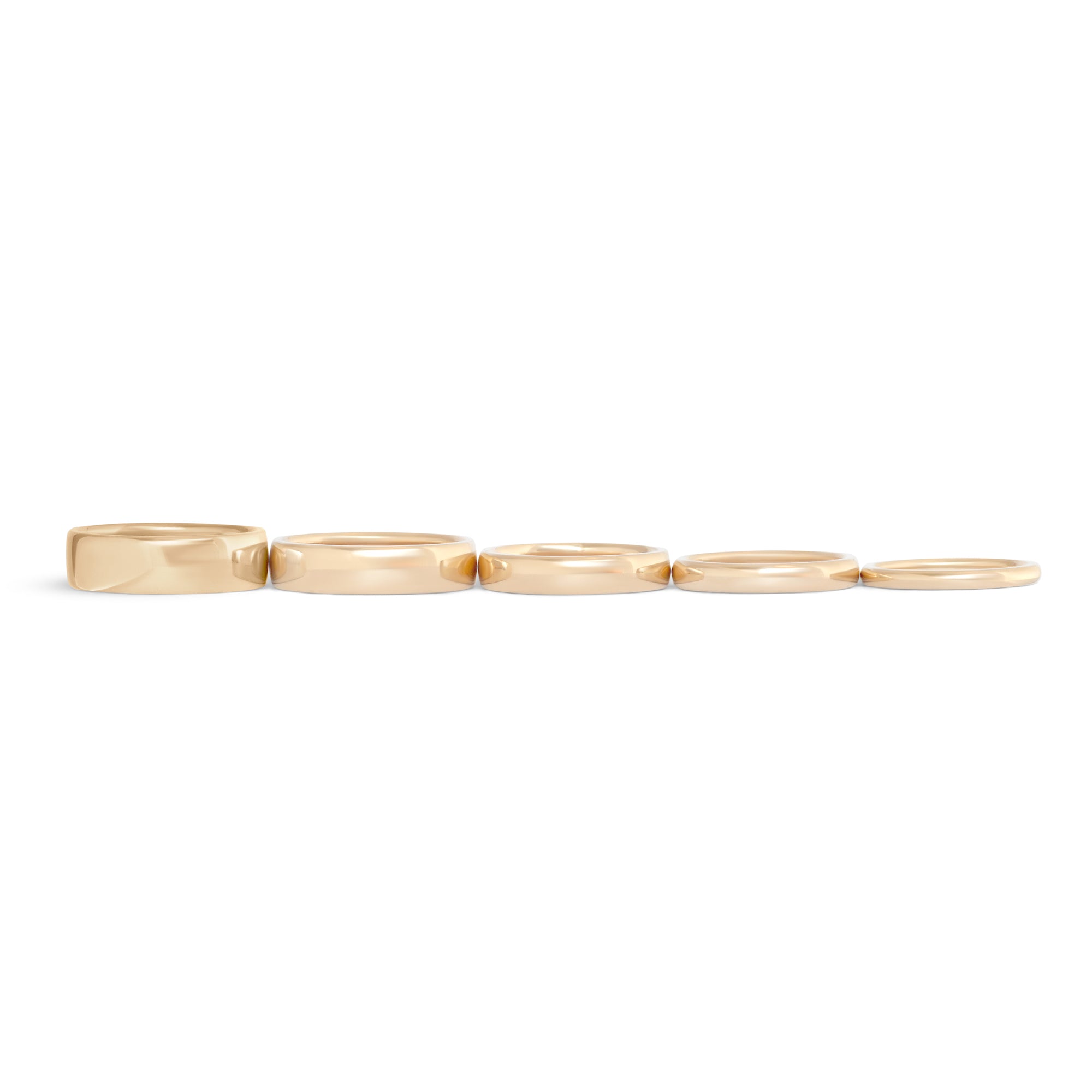 Lined up view of 14k Yellow Gold Dome Bands in various widths