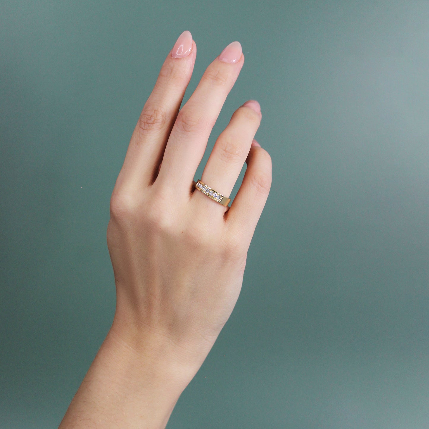 Model wears Flat Band / Bright Cut Lab Diamonds on ring finger