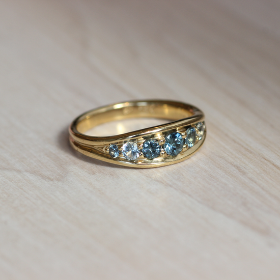 Side view of Cornice Ring / Tapered Wide + Ombre Sapphires