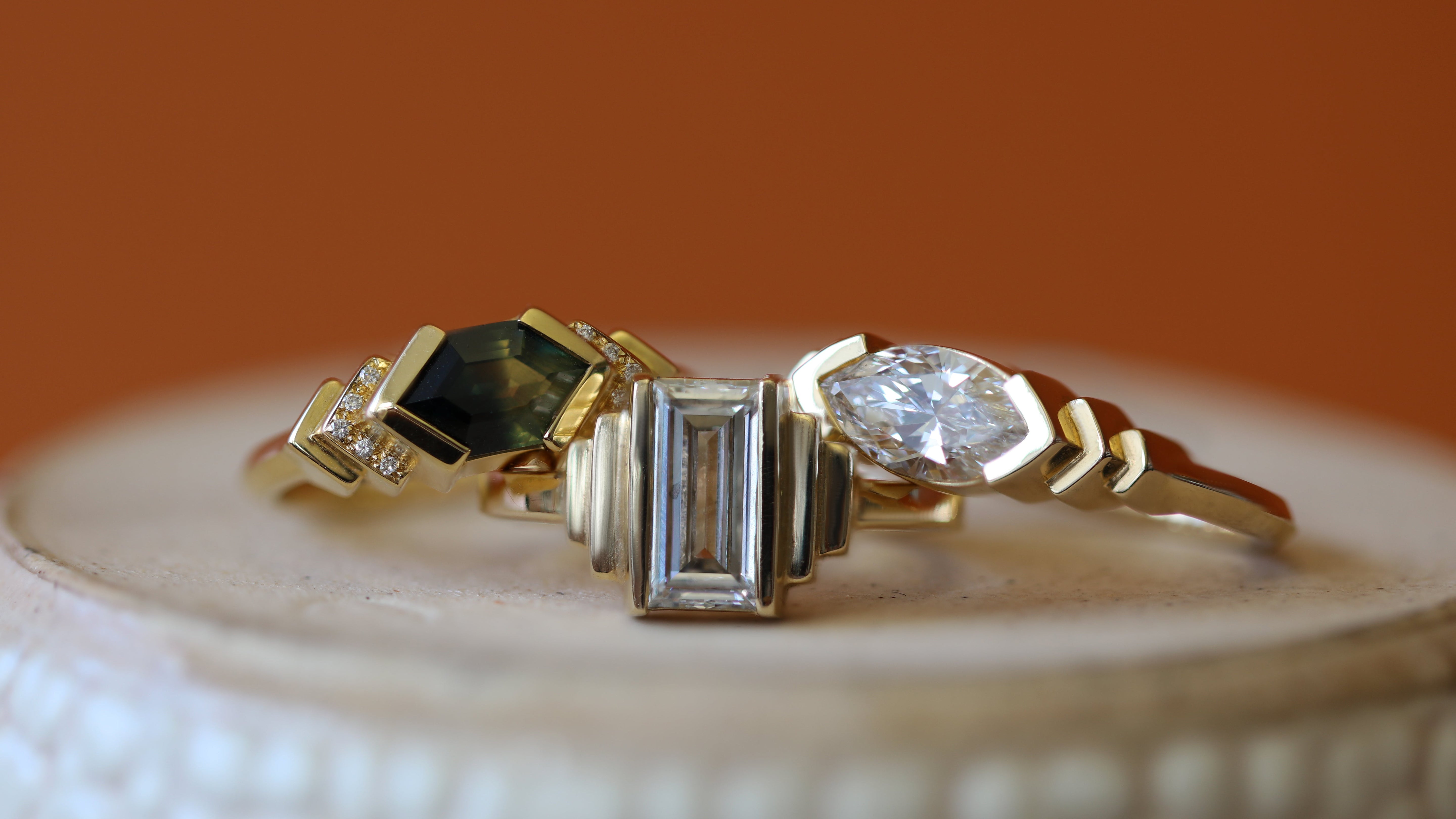Stacked view of Kent Ring Hexagon Sapphire 1.63ct, Kent Ring Baguette Lab Diamond 1.2ct, and Kent Ring Marquise Lab Diamond 1.02ct
