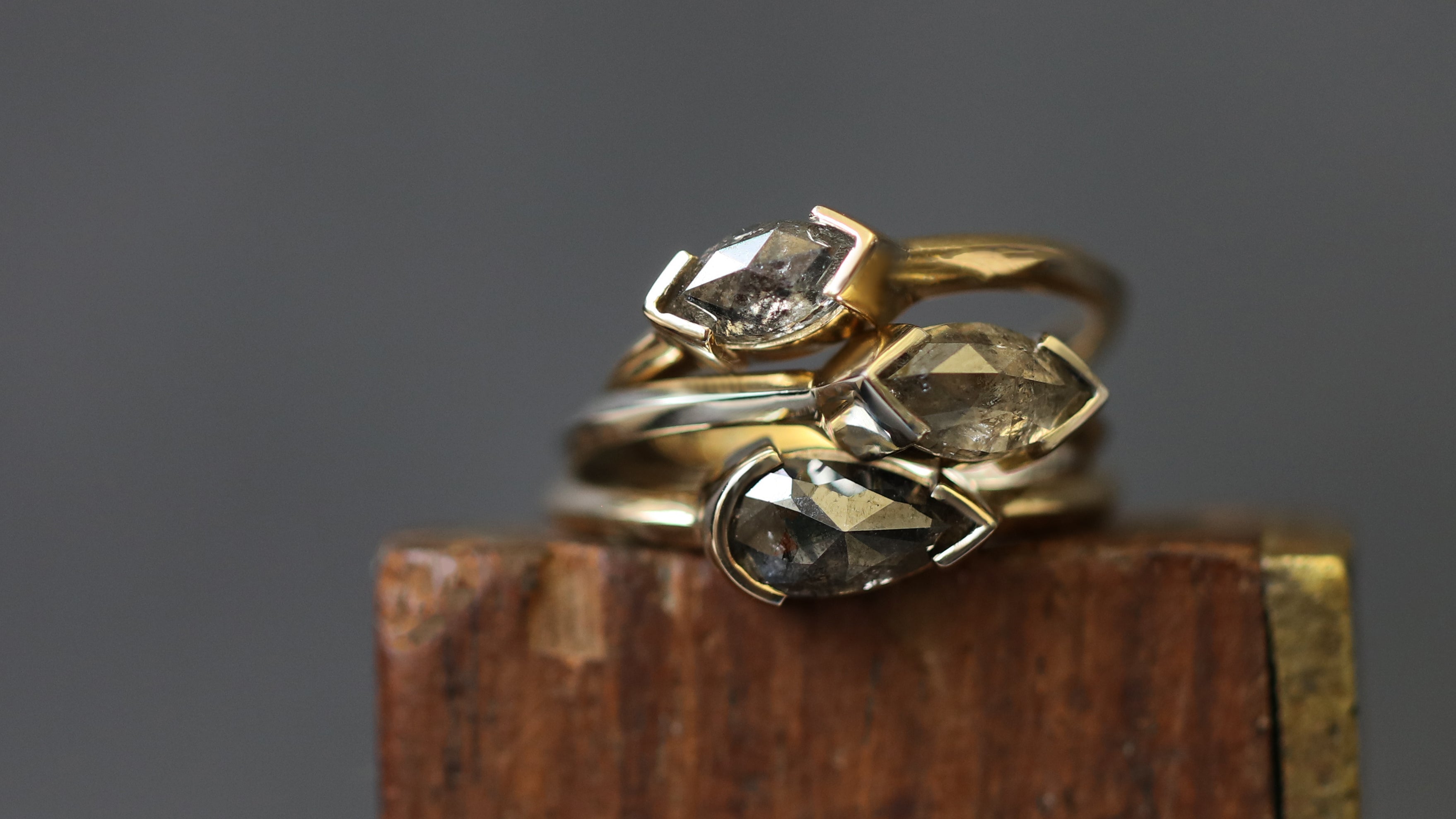 Lifestyle shot of a stack of three rings from the Sideways Collection by Goldpoint