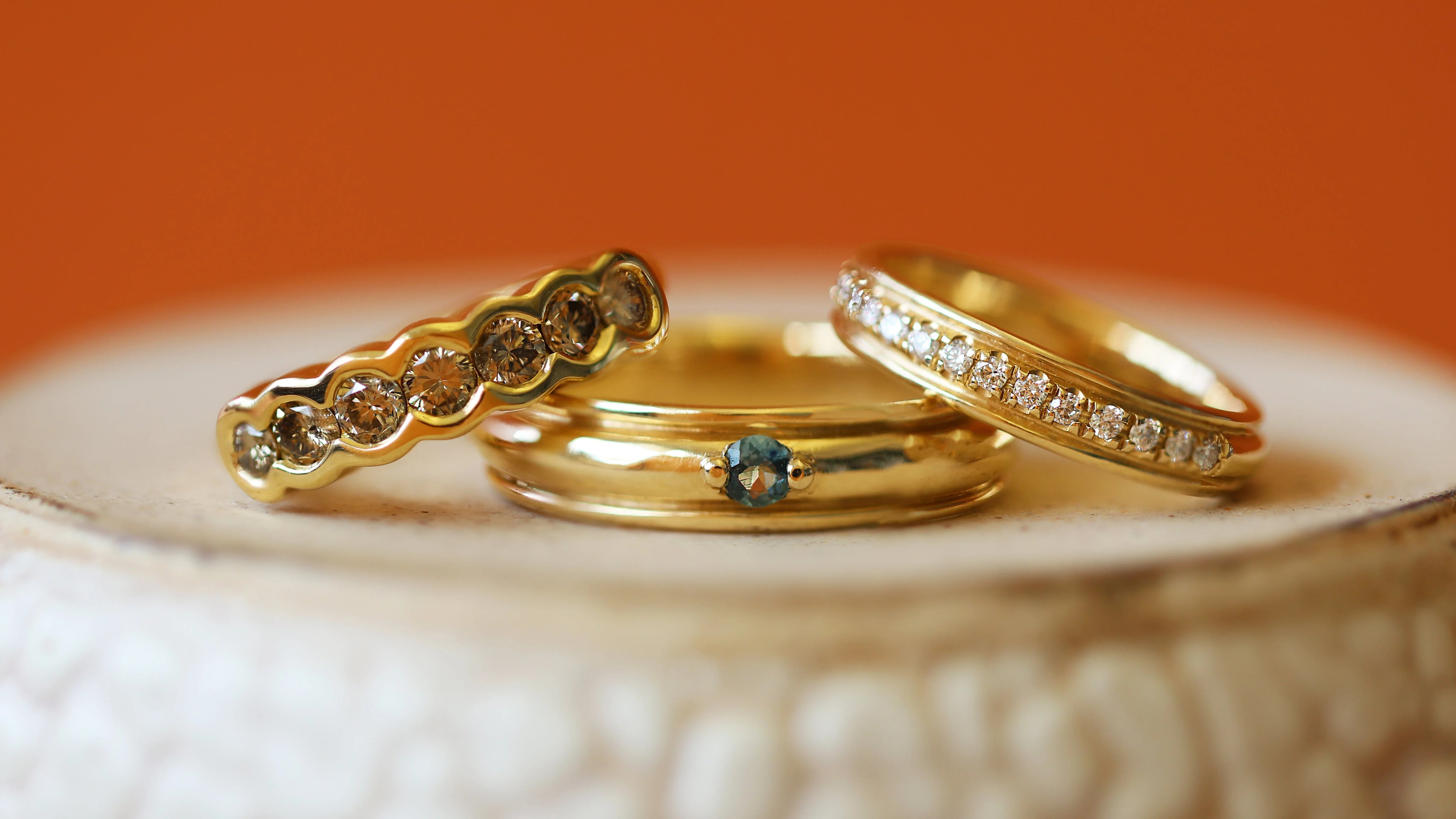 Stacked view of Cloud 7 Band Round Champagne Diamonds, Cornice Band Wide Bead Round Sapphire, and Cornice Band Pave Round Lab Diamonds