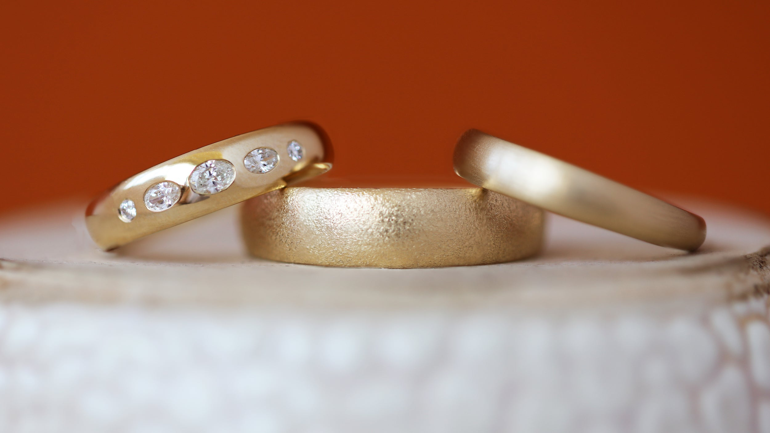 Stacked view of Ellipse Band / Medium + Lab Diamonds, Ellipse Band 5mm in Yellow Gold, and Ellipse Band 3mm in Yellow Gold 