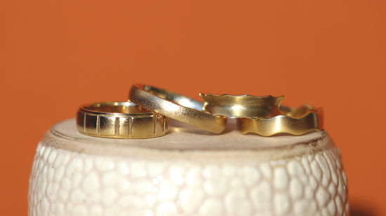 Group of Goldpoint bands without stones stacked together