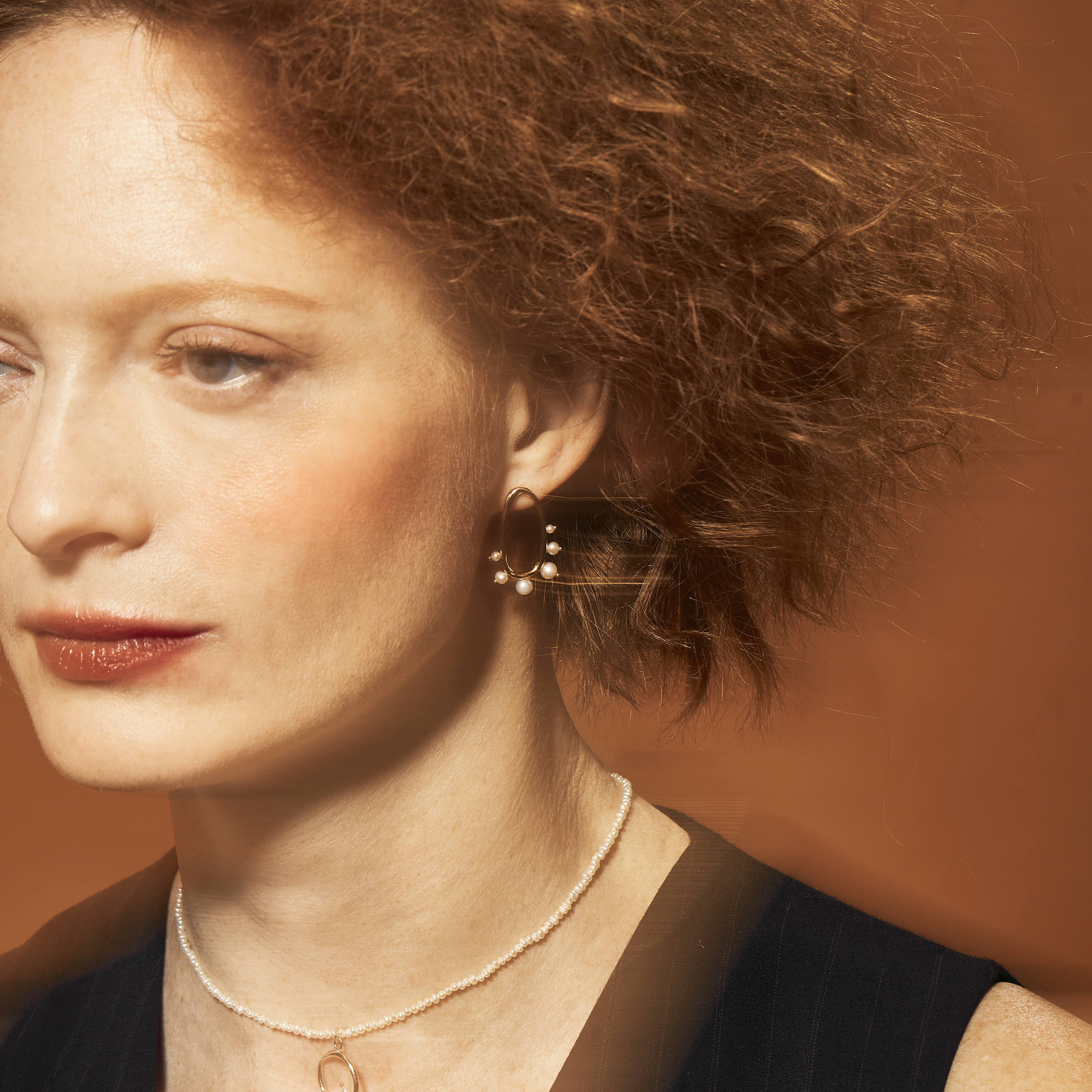 Model wearing Amorphous Pearl Earrings / Large Oval