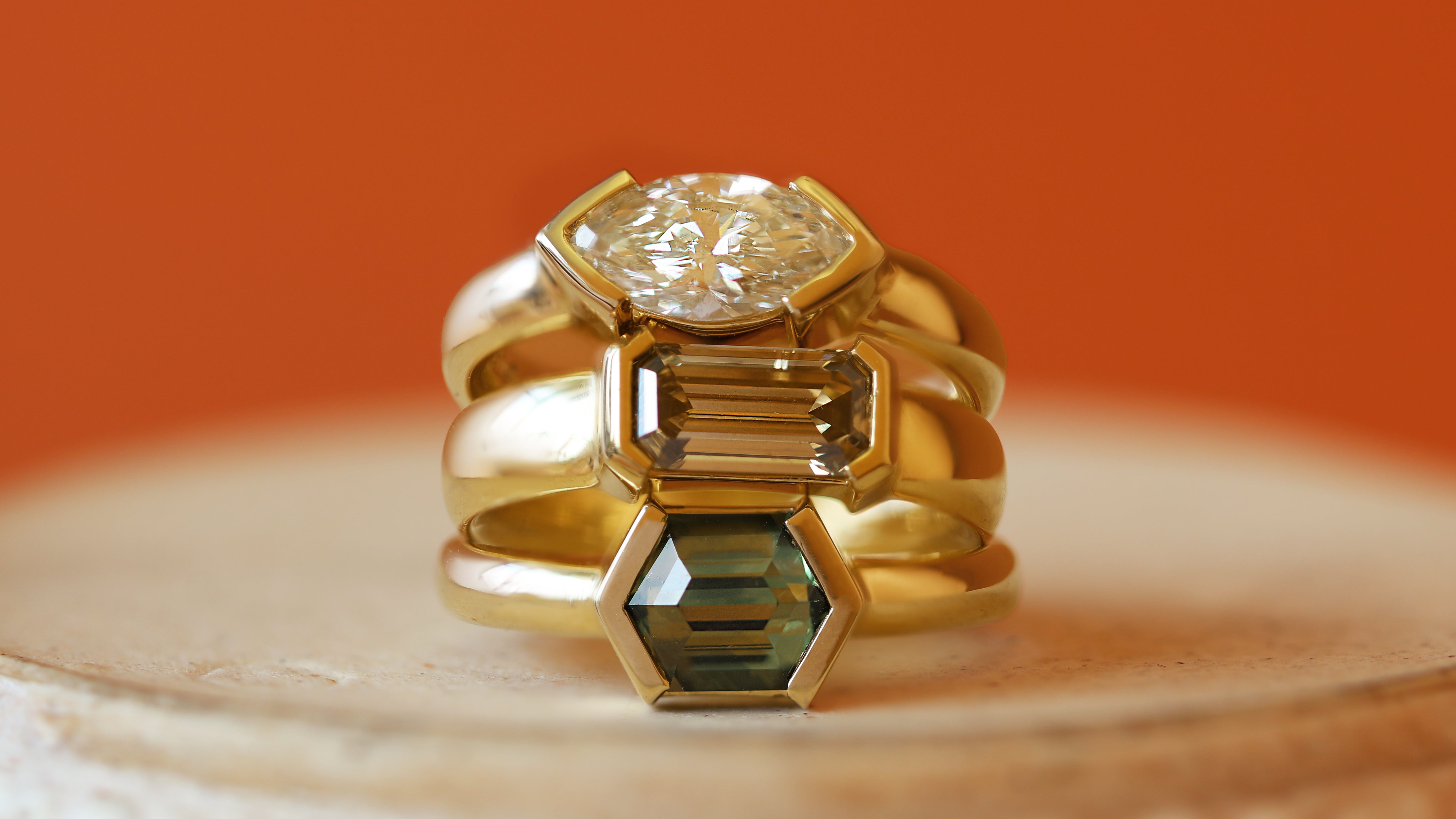 Stacked view of Dobbin Ring Marquise Lab Diamond 1.12ct, Dobbin Ring Emerald Cut Natural Diamond 1.13ct, and Dobbin Ring Hexagon Sapphire 1.77ct