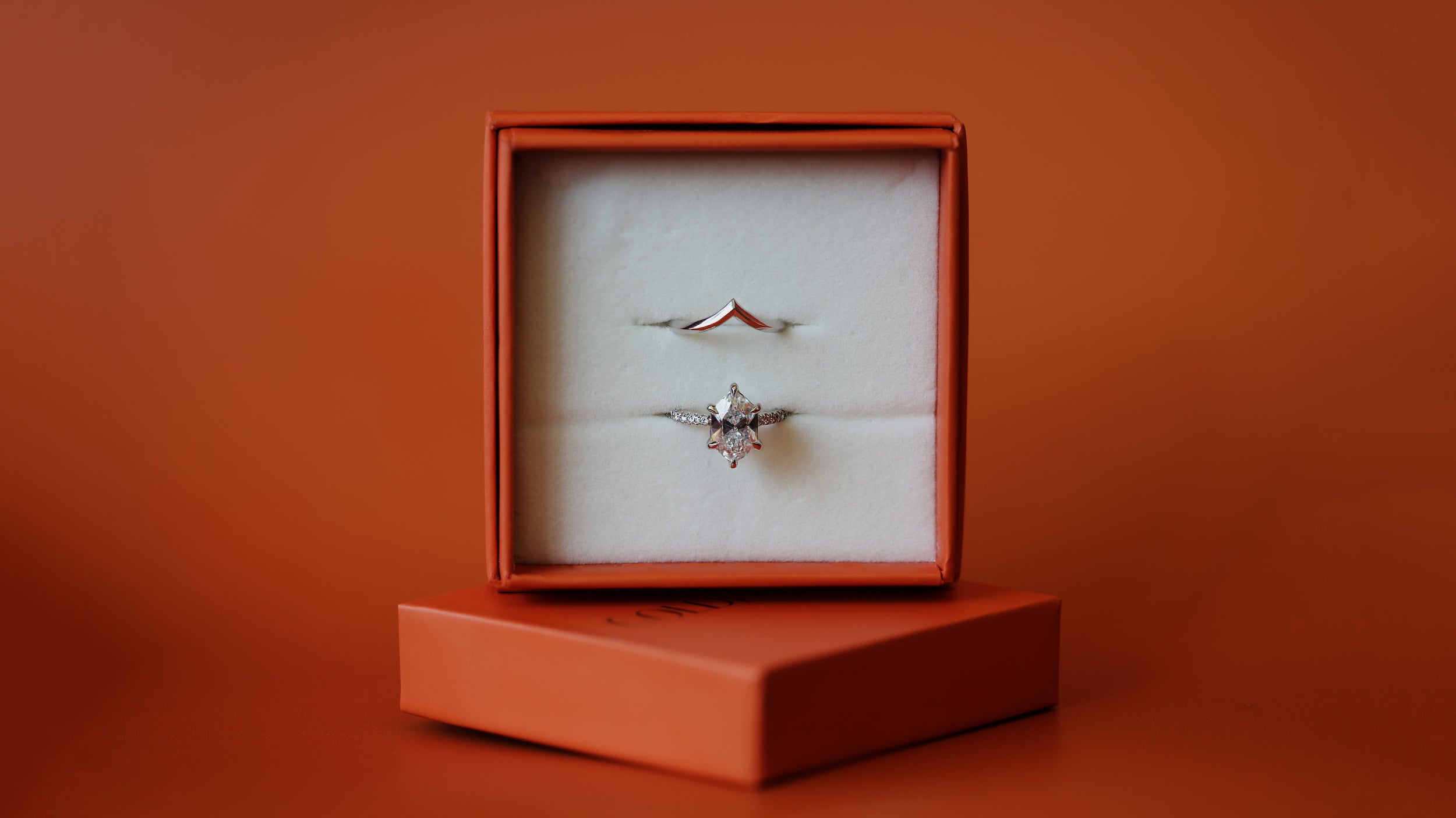 Stacked view of three white diamond engagement rings by Goldpoint