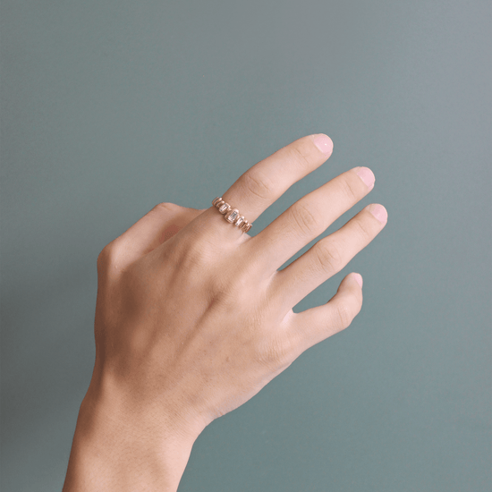 Model wears Ruins Band / Medium + Lab Baguette Diamonds on index finger