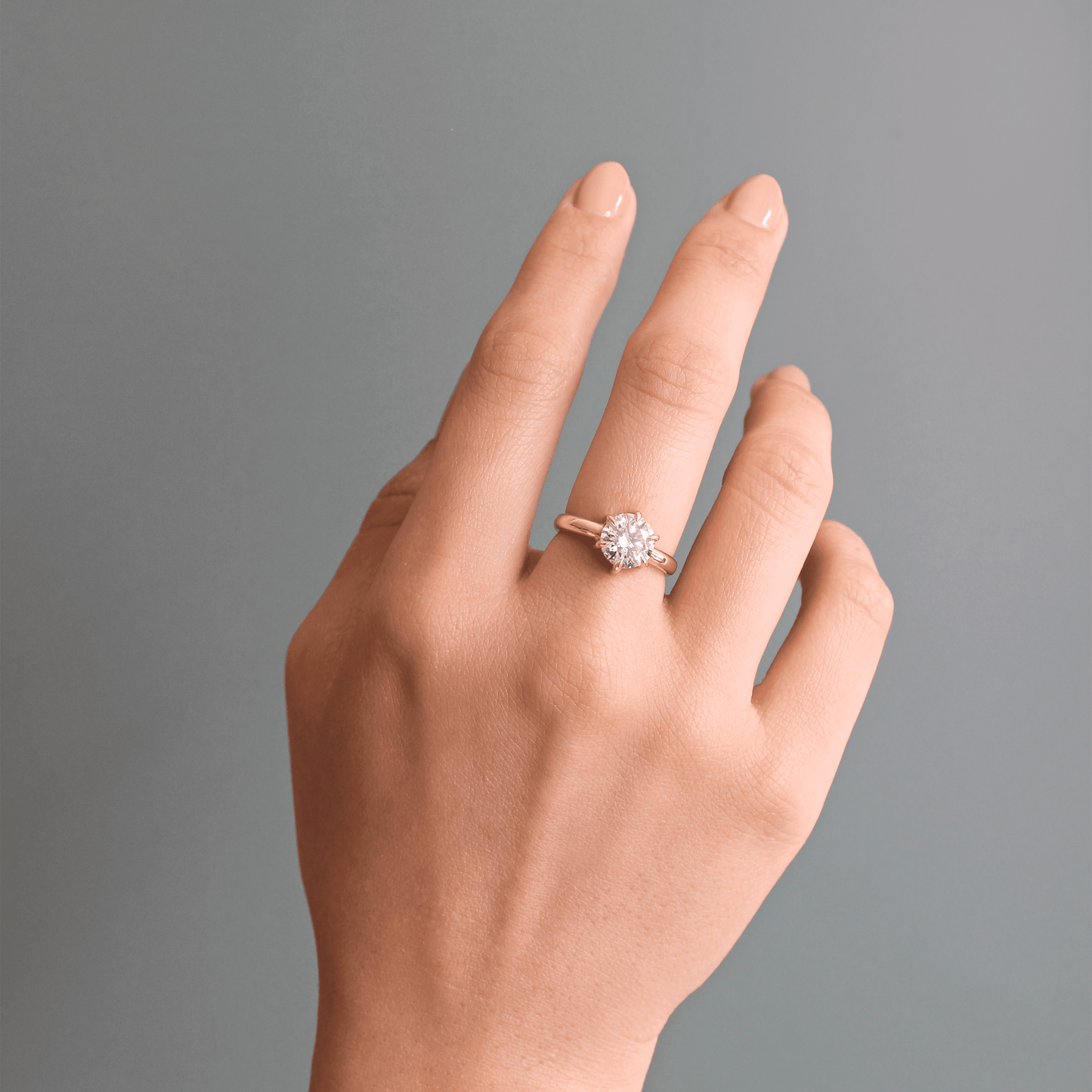 Model wears Ellipse Ring / Lab Round Diamond on middle finger