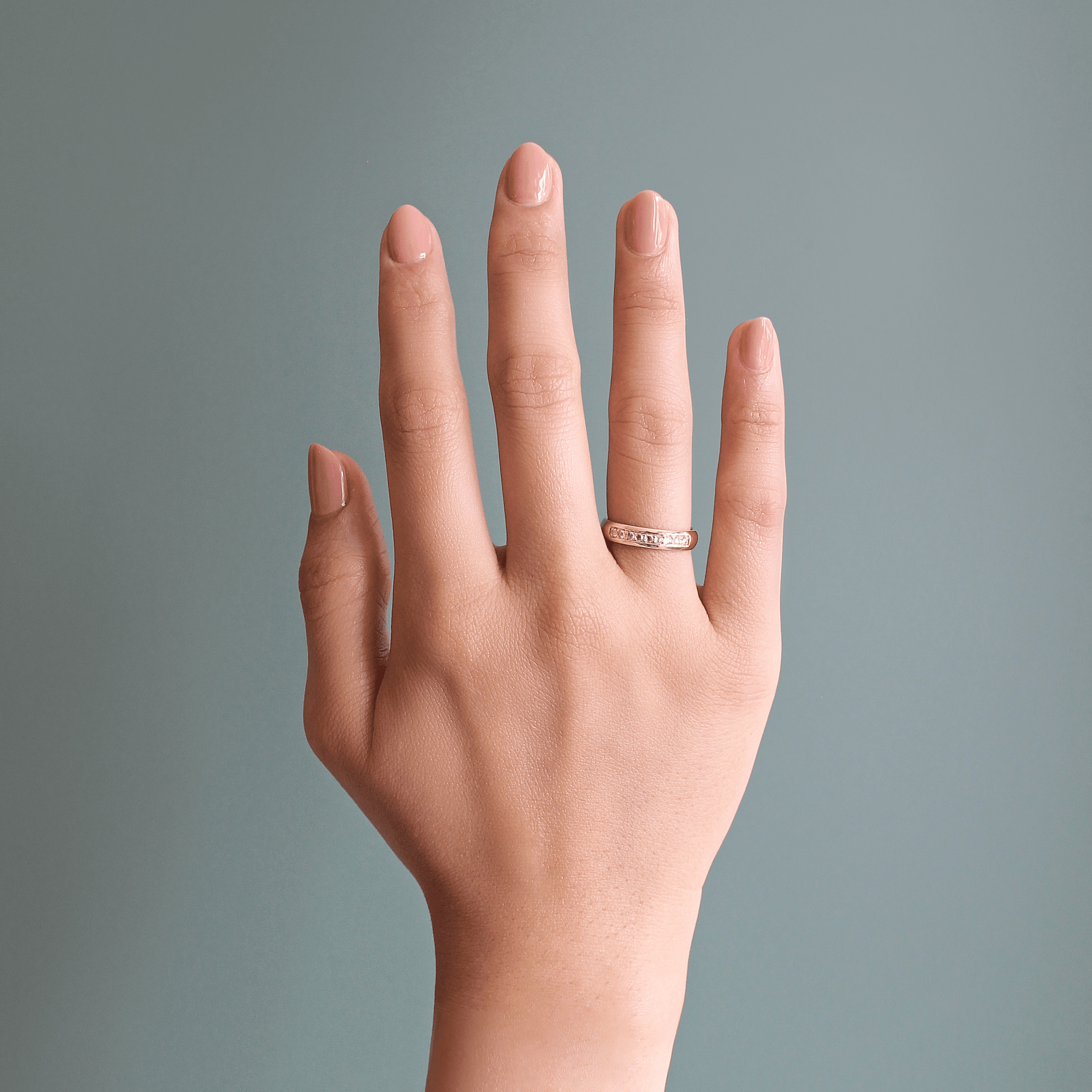 Model wears Thick Dome Band 4mm Bright Cut Rose Cut Diamonds in 14k yellow gold on ring finger