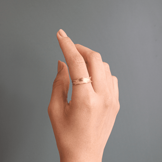 Model with Aloe Band on index finger