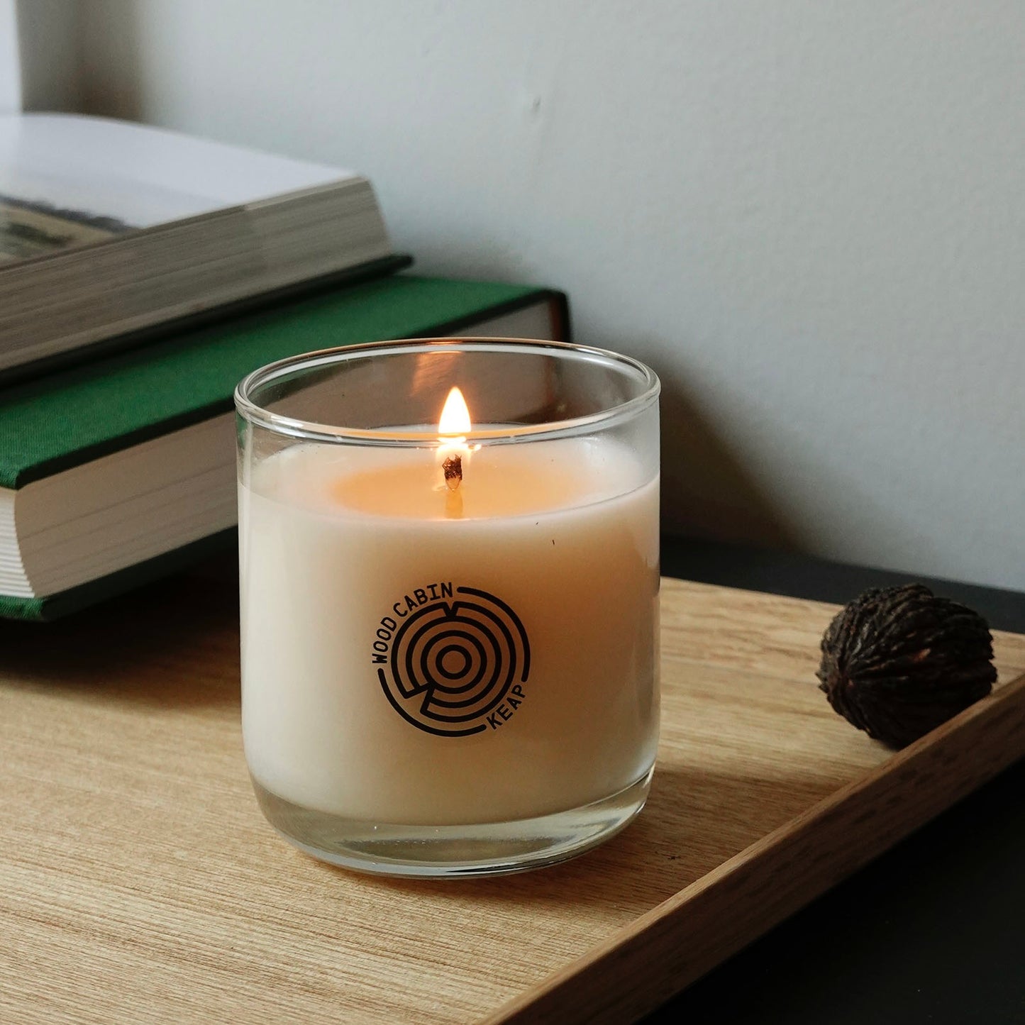 Lifestyle shot of Wood Cabin Scented Candle burning