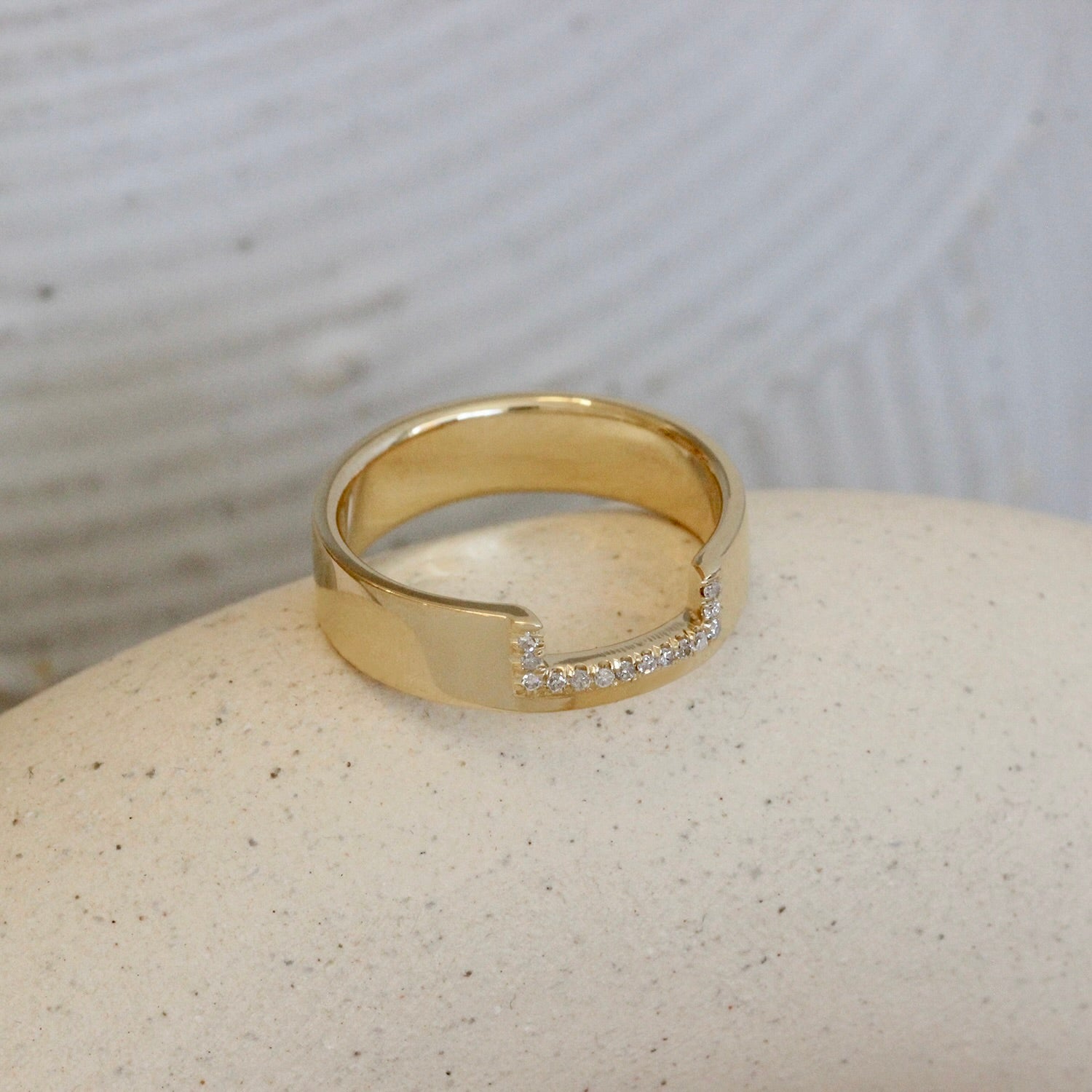 Lifestyle angled view of Horizon Band Rectangle Cutout Pave Round Diamonds in 14k yellow gold
