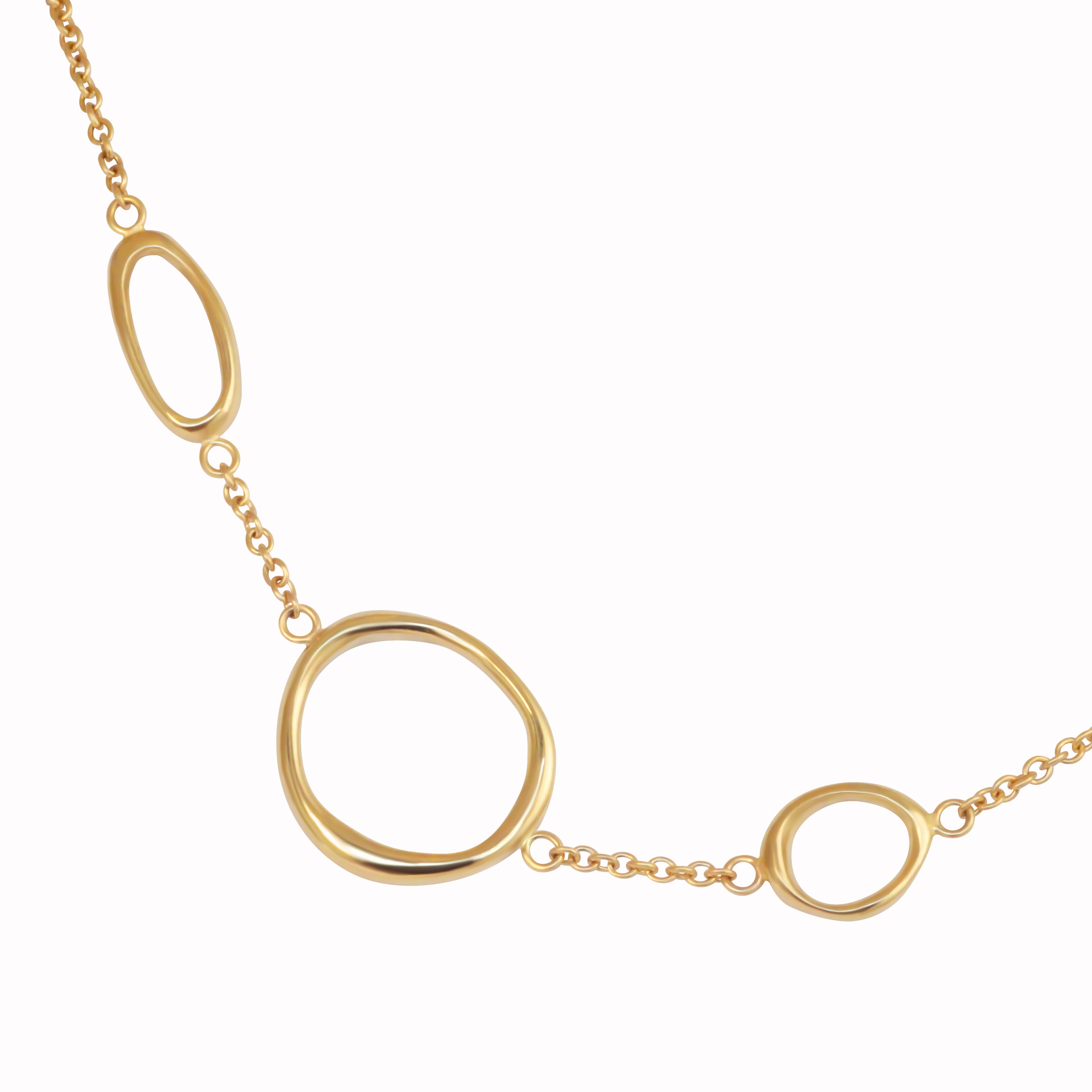Amorphous charms on a chain bracelet.