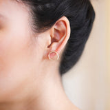 Model wears Amorphous Earring / Large Circle by Goldpoint in ear
