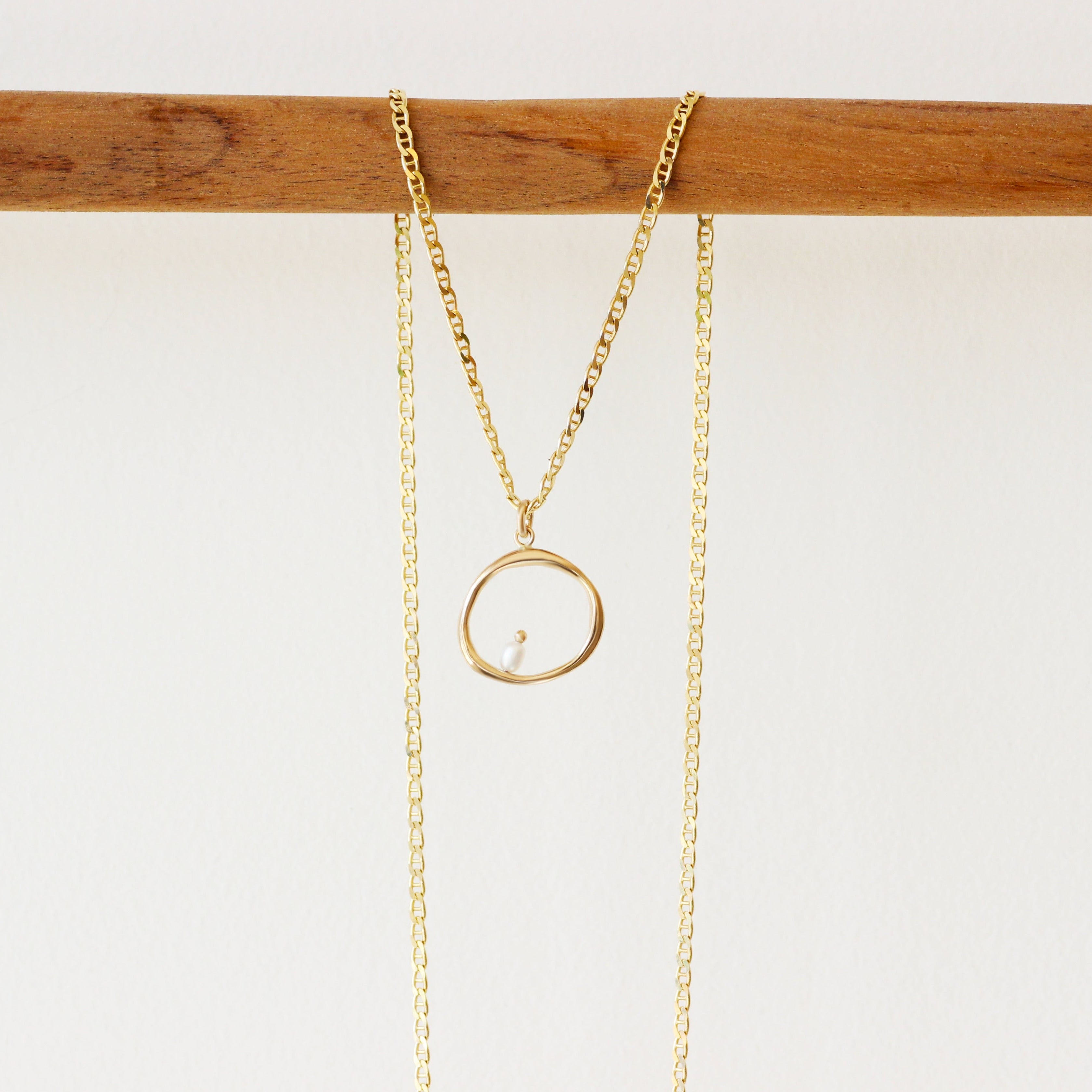 Lifestyle shot of Amorphous Charm / Large Circle + Pearl by Goldpoint