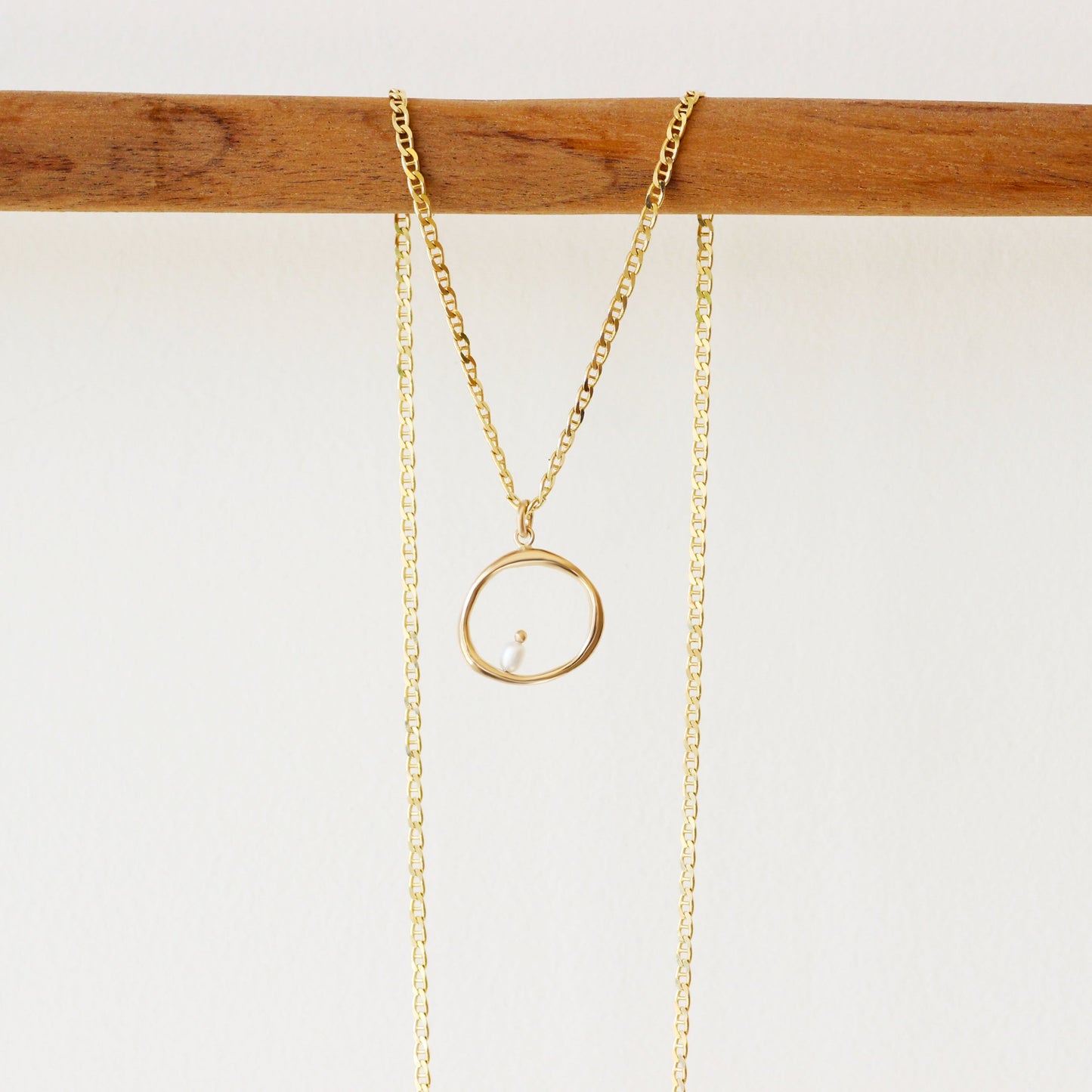 Lifestyle shot of Amorphous Charm / Large Circle + Pearl by Goldpoint