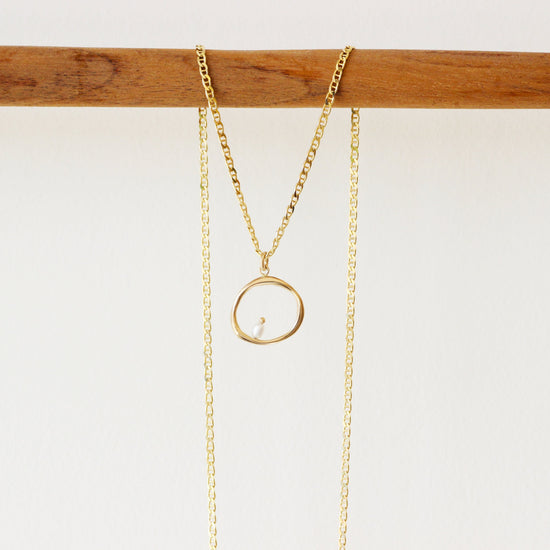 Lifestyle shot of Amorphous Charm / Large Circle + Pearl by Goldpoint