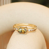 Lifestyleangled side view of Ash Ring Elongated Cushion Sapphire 1.04ct by Goldpoint Jewelry on a ceramic with blurred background