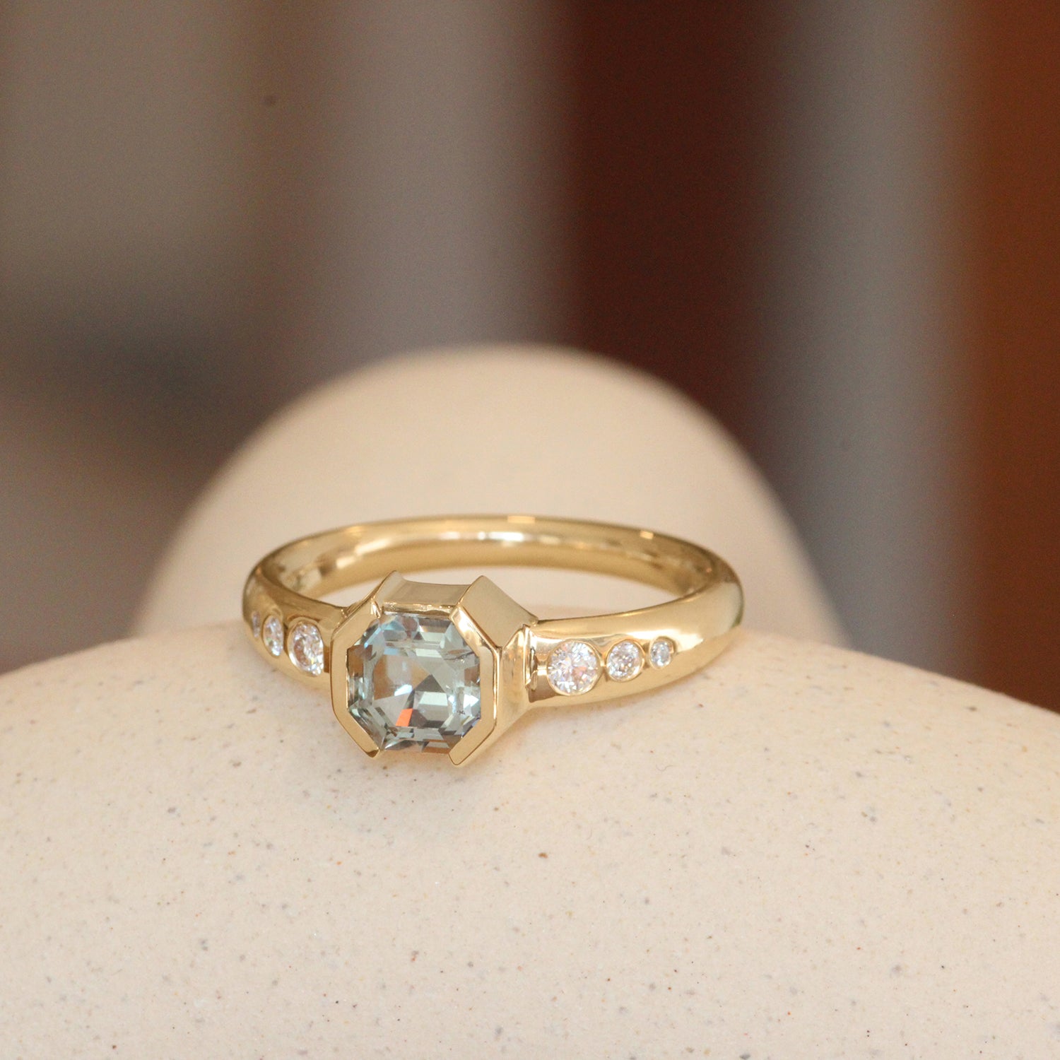 Lifestyle angled view of Ash Ring Asscher Cut Sapphire 1.1ct in 14k yellow gold by Goldpoint