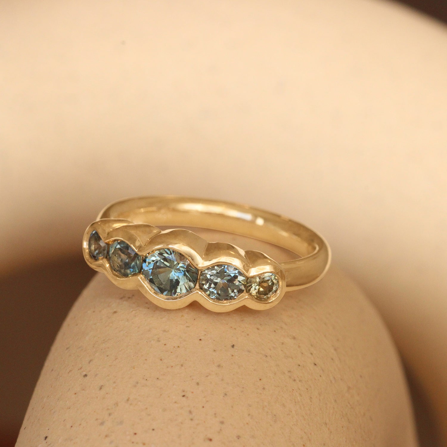 Lifestyle angled view of Clay 5 Ring Round Sapphires  0.4ct by Goldpoint