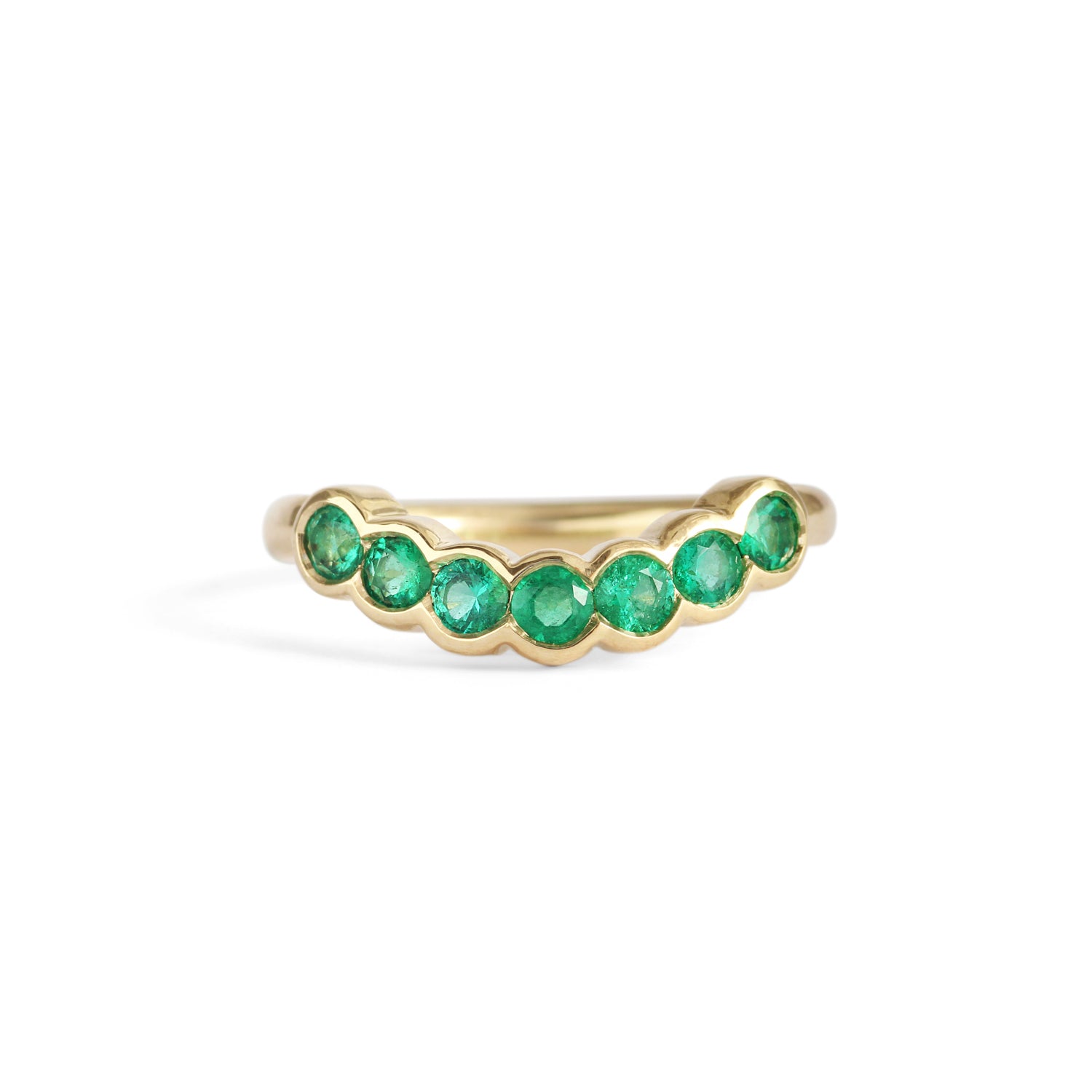 Front view of Cloud 7 Band Curve Round Emeralds in 14k yellow gold