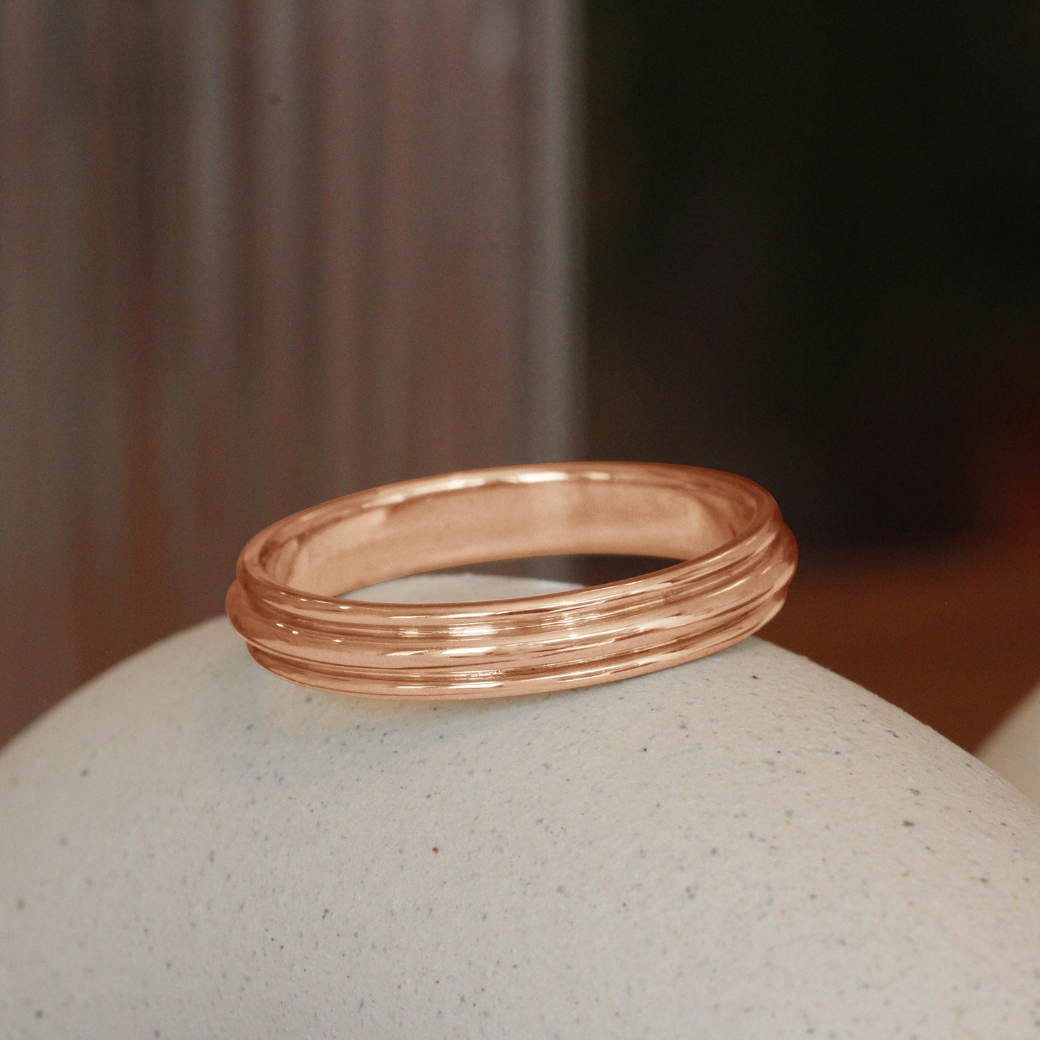 Lifestyle angled view of Cornice Band in 14k Rose Gold