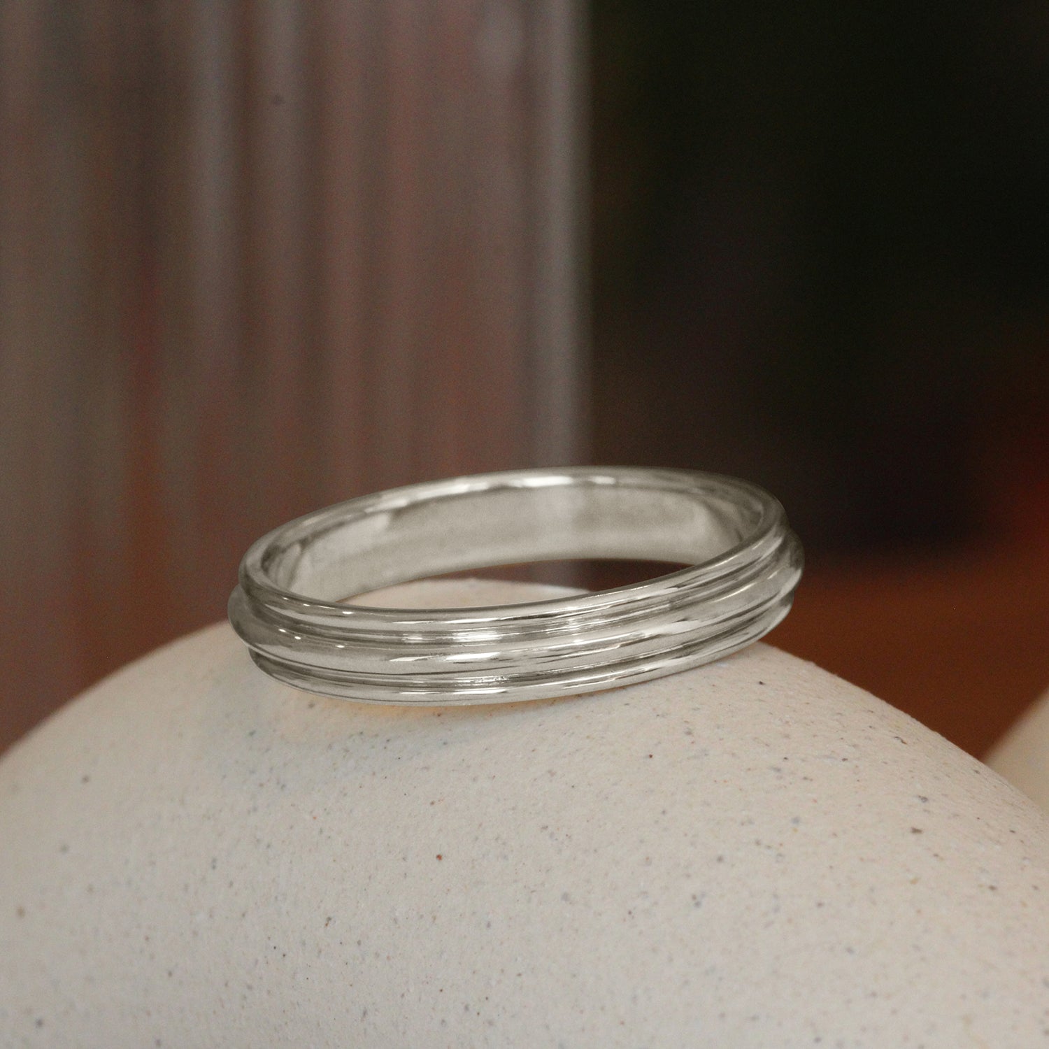 Lifestyle angled view of Cornice Band in 14k White Gold