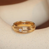 Lifestyle angled view of Cornice Band Wide / Bead Round Lab Diamond in Yellow Gold by Goldpoint Jewelry on a ceramic