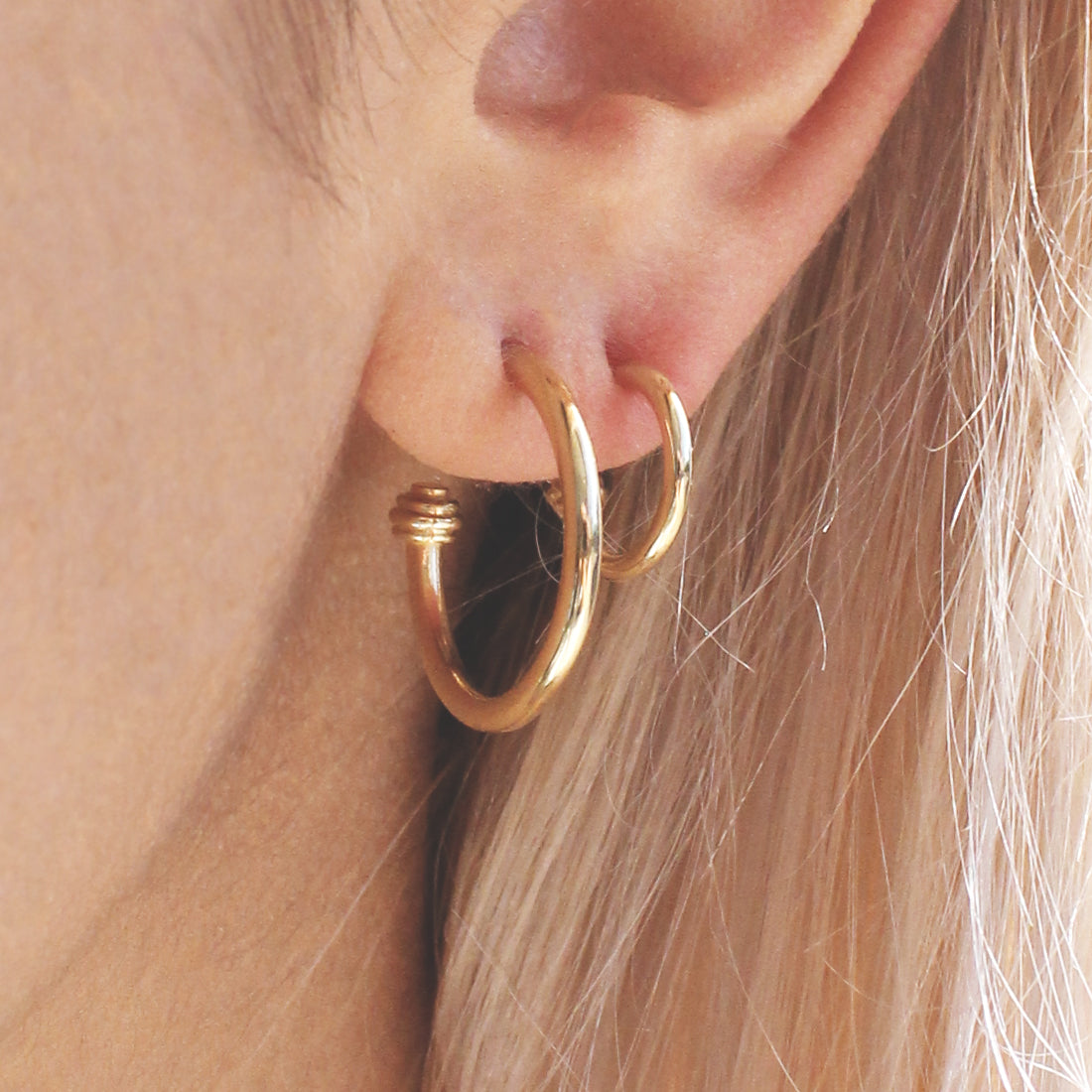 Model wears Cornice End Hoop / Large and Cornice End Hoop / Small in ear