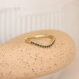 Lifestyle angled view of Flat Band Deep Curve Pave Round Black Diamonds in 14k yellow gold