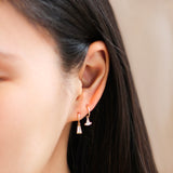 Model wears Edge Charm / Lab Marquise Diamond on a hoop with another earring configuration by Goldpoint Jewelry
