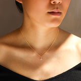 Model wears Edge Charm / Lab Marquise Diamond on a thin chain by Goldpoint Jewelry