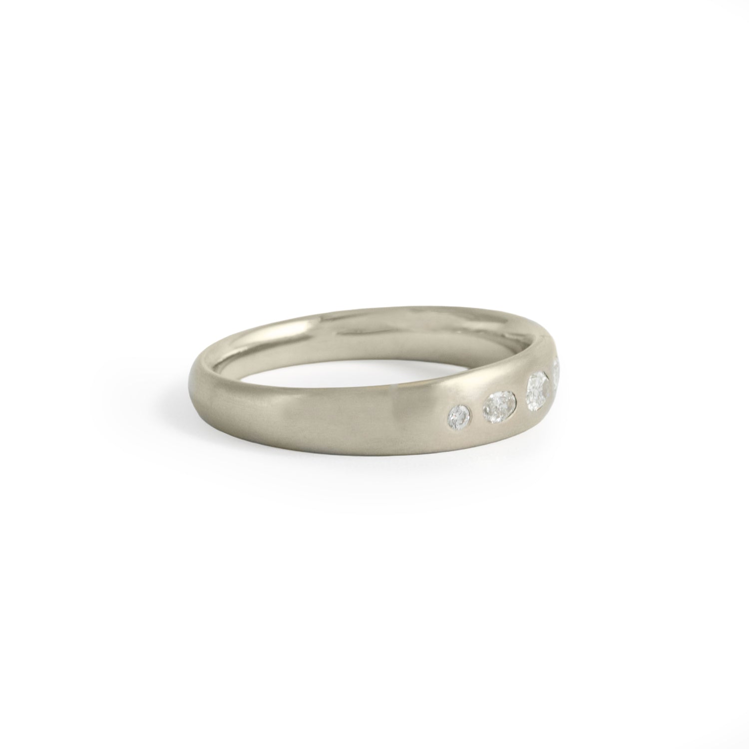 Side view of Ellipse Band 5mm / Flush Oval Lab Diamond / in 14k White Gold by Goldpoint Jewelry