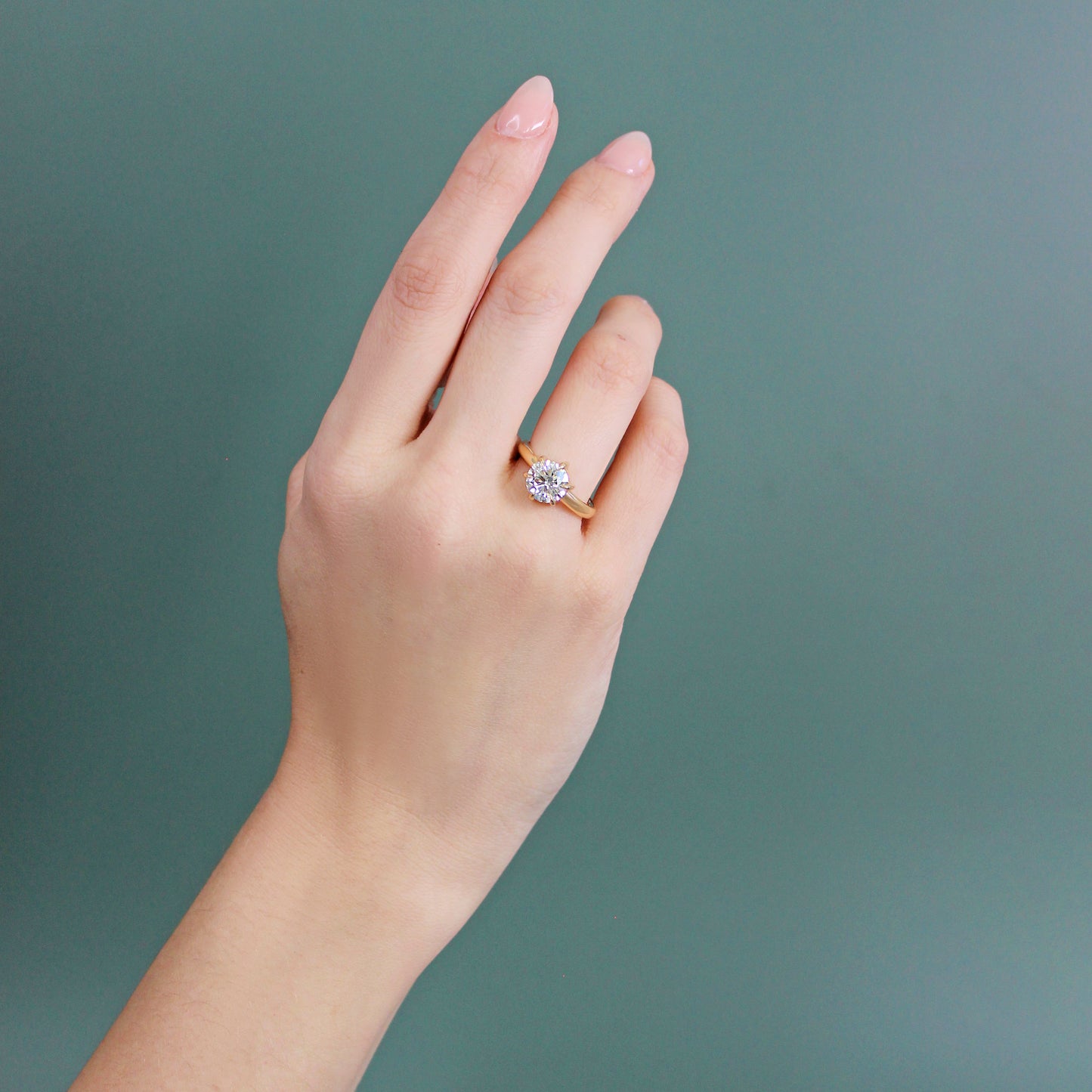 Model wears Ellipse Ring / Lab Round Diamond on ring finger