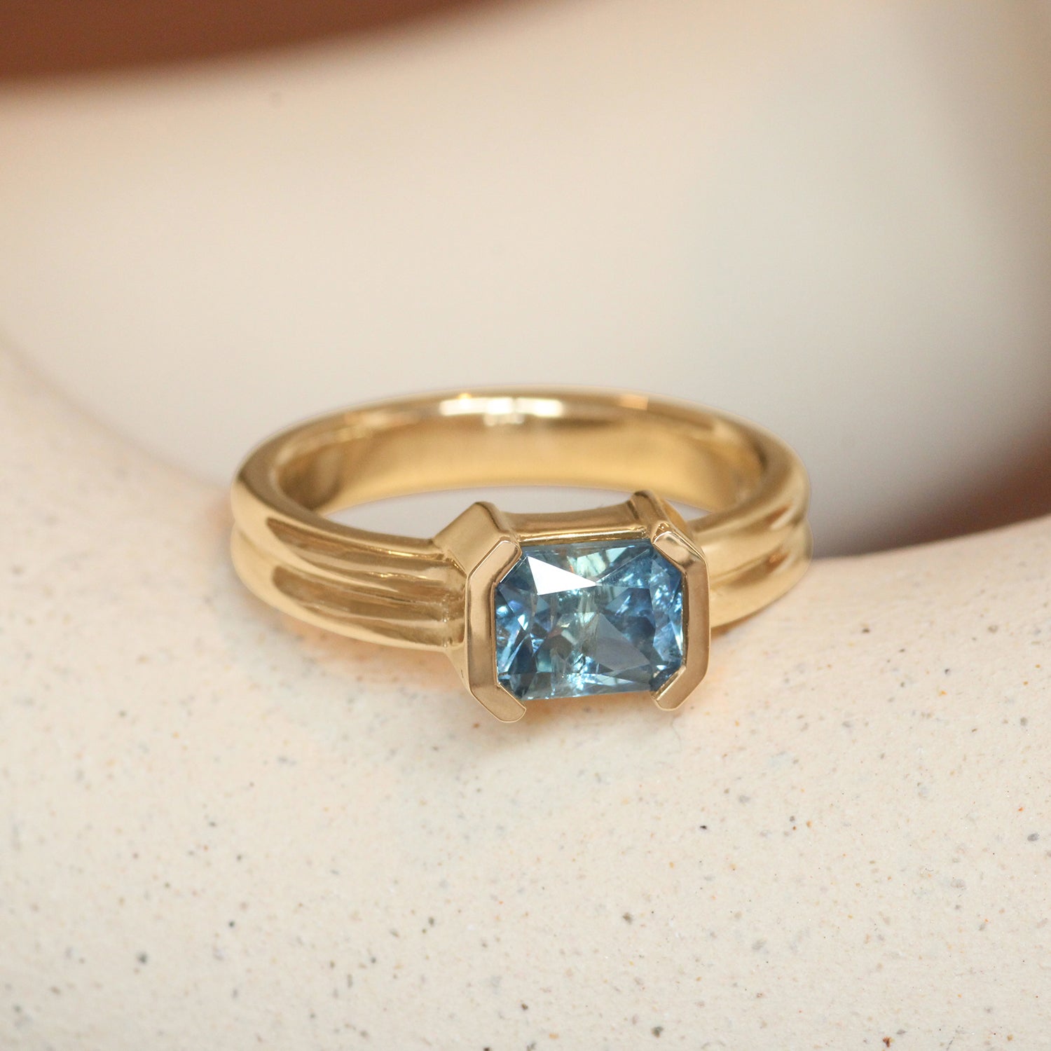 Lifestyle angled view of Franklin Ring Emerald Cut Sapphire 1.53ct by Goldpoint Jewelry