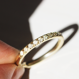 Model holds Dome Band Thick 2mm / Pave Round Lab Diamonds / 14k in Yellow Gold by Goldpoint Jewelry in hand