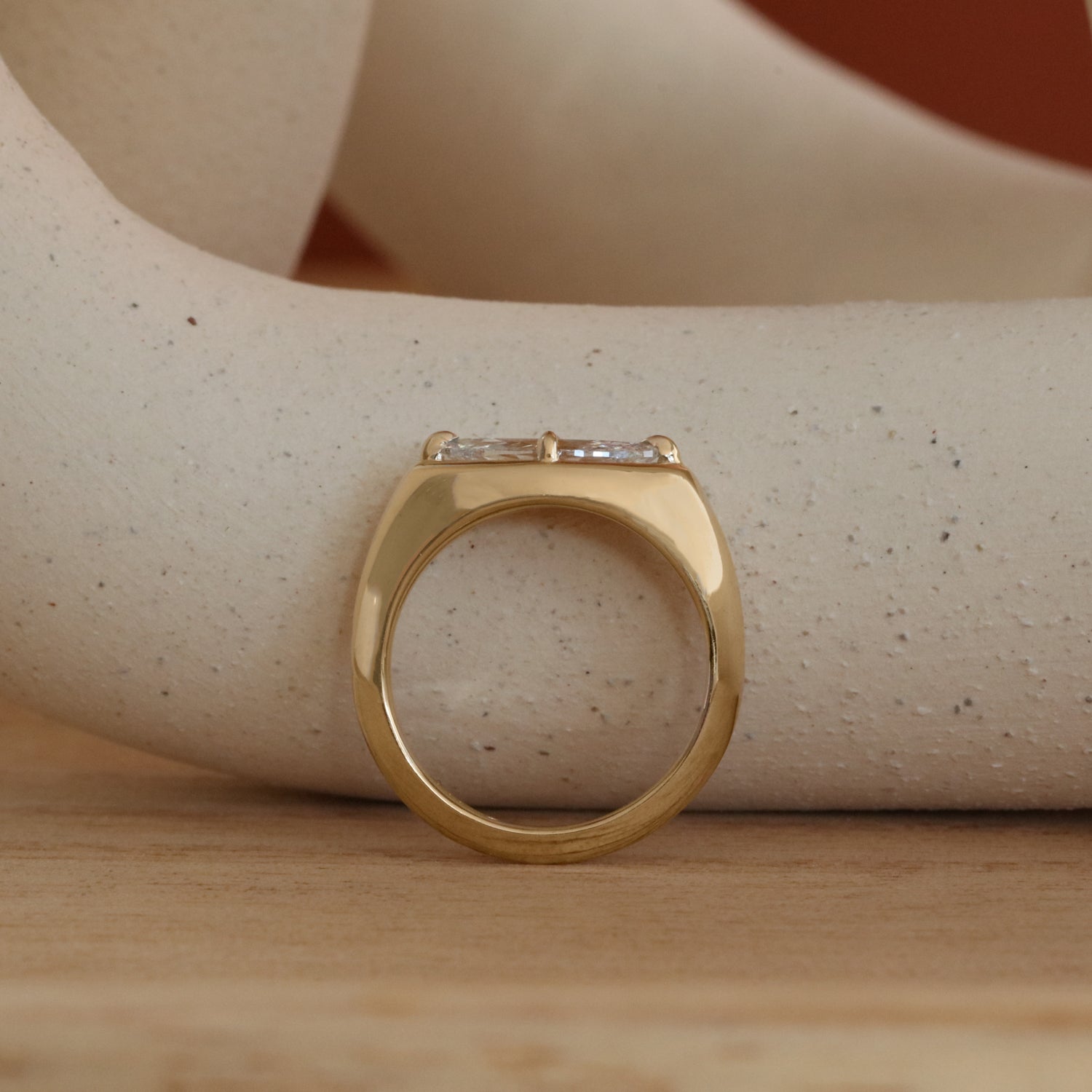 Lifestyle side profile view of Leonard 4 Ring Marquise Diamond 1.02ct by Goldpoint Jewelry on a ceramic with a orange background