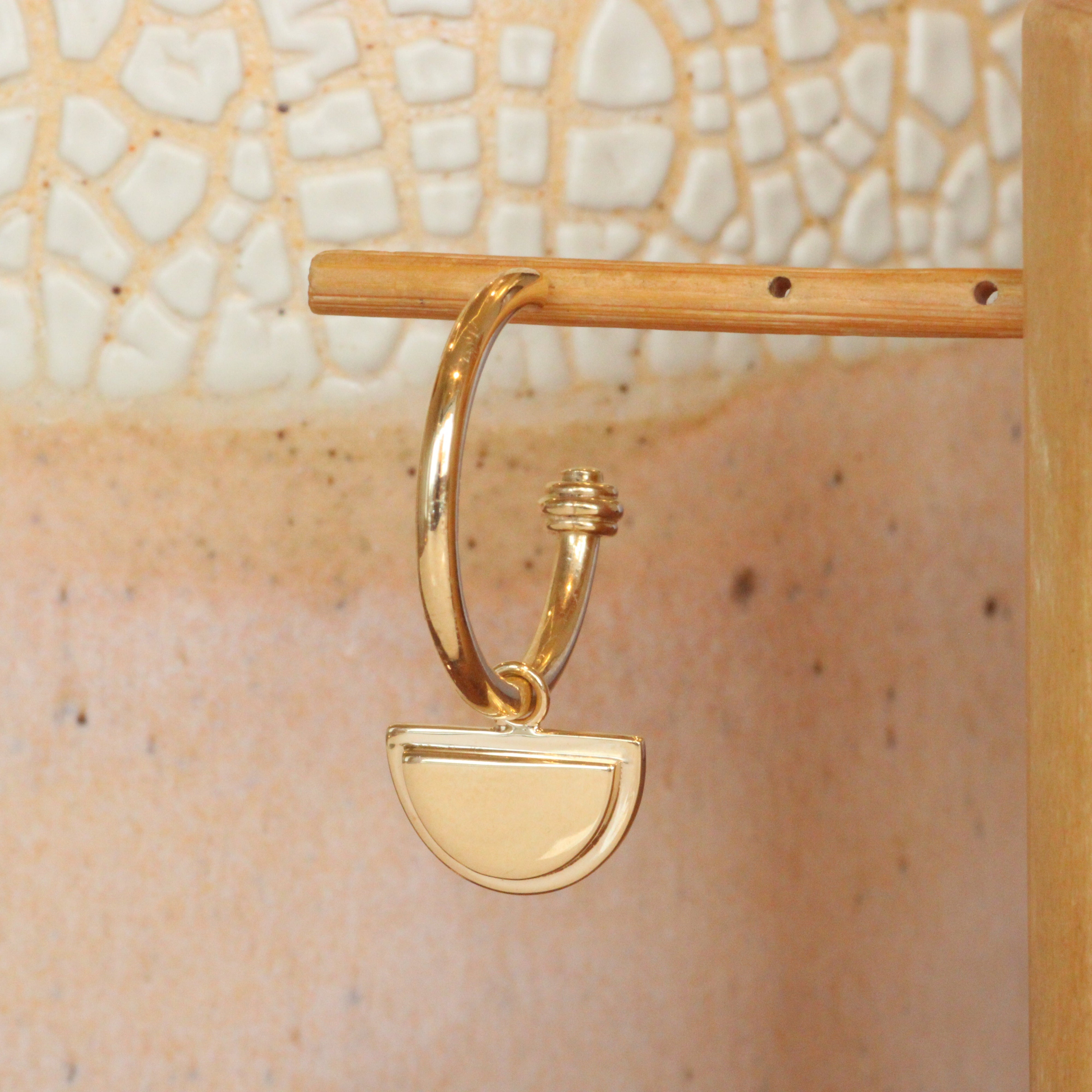 Front view of Step Frame Charm / Half Moon on a Cornice Hoop by Goldpoint Jewelry