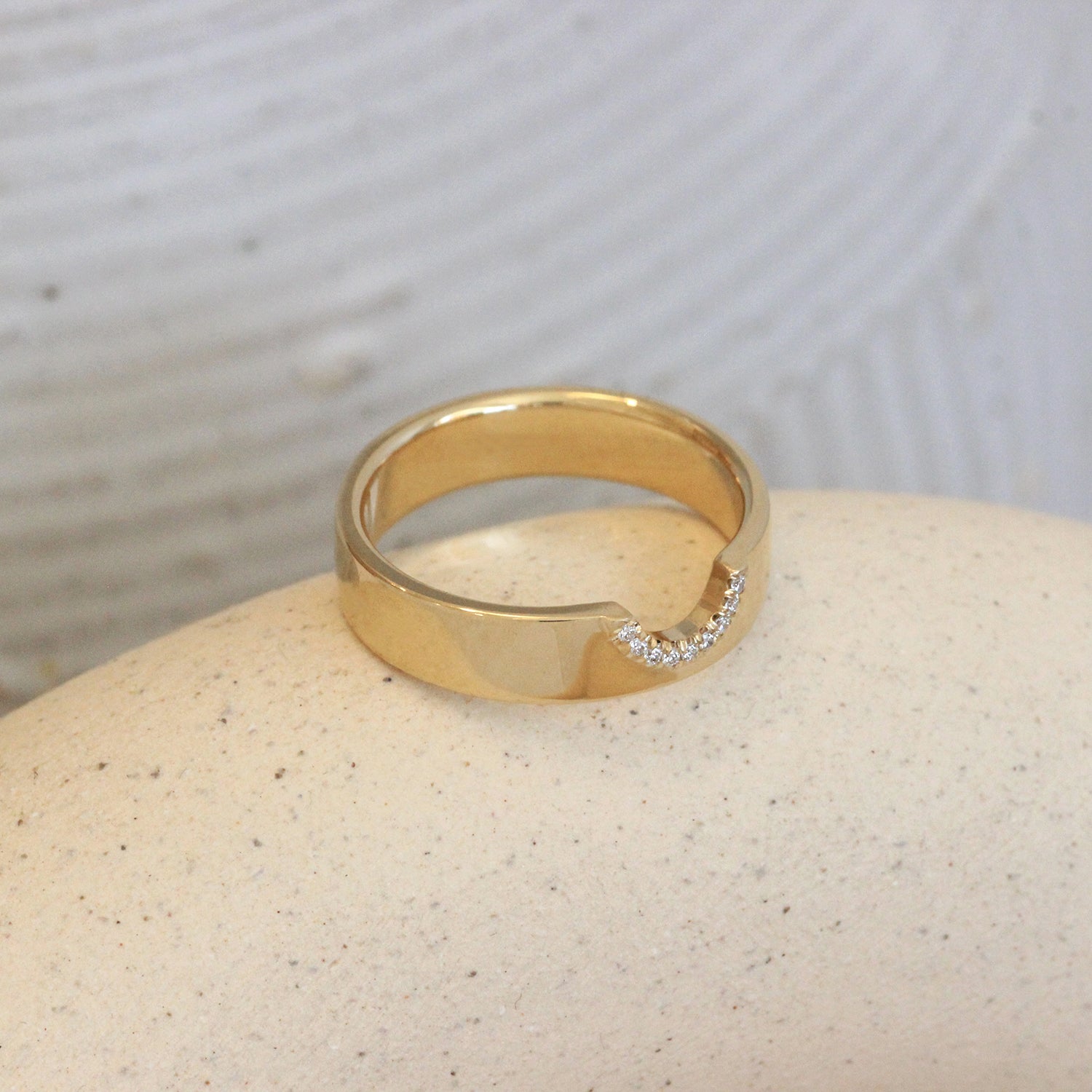 Lifestyle angled view of Horizon Band Half Moon Cutout Pave Round Diamonds in 14k yellow gold
