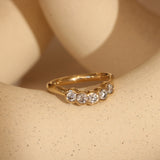 Lifestyle side view of Cloud 5 Band Curve  Round Lab Diamonds in 14k yellow gold