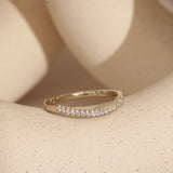 Lifestyle angled view of Flat Band Soft Curve Pave Round Diamonds in 14k white gold