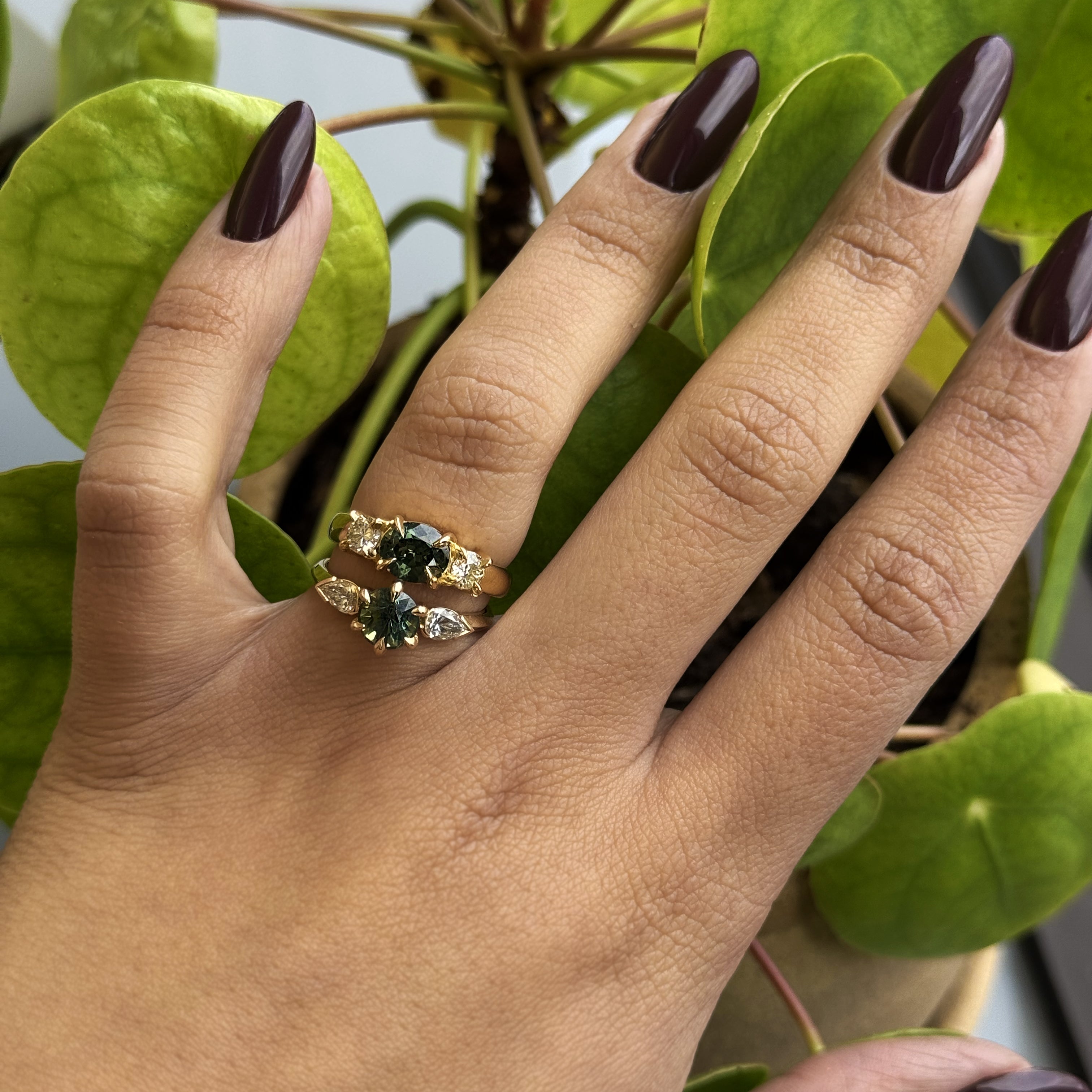 Model wears Wythe Ring Round Sapphire 1.5ct stacked on other engagement ring by Goldpoint