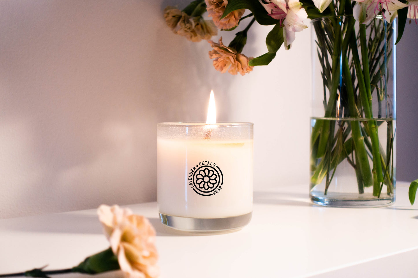 Lifestyle shot of Lavender + Petals Scented Candle burning